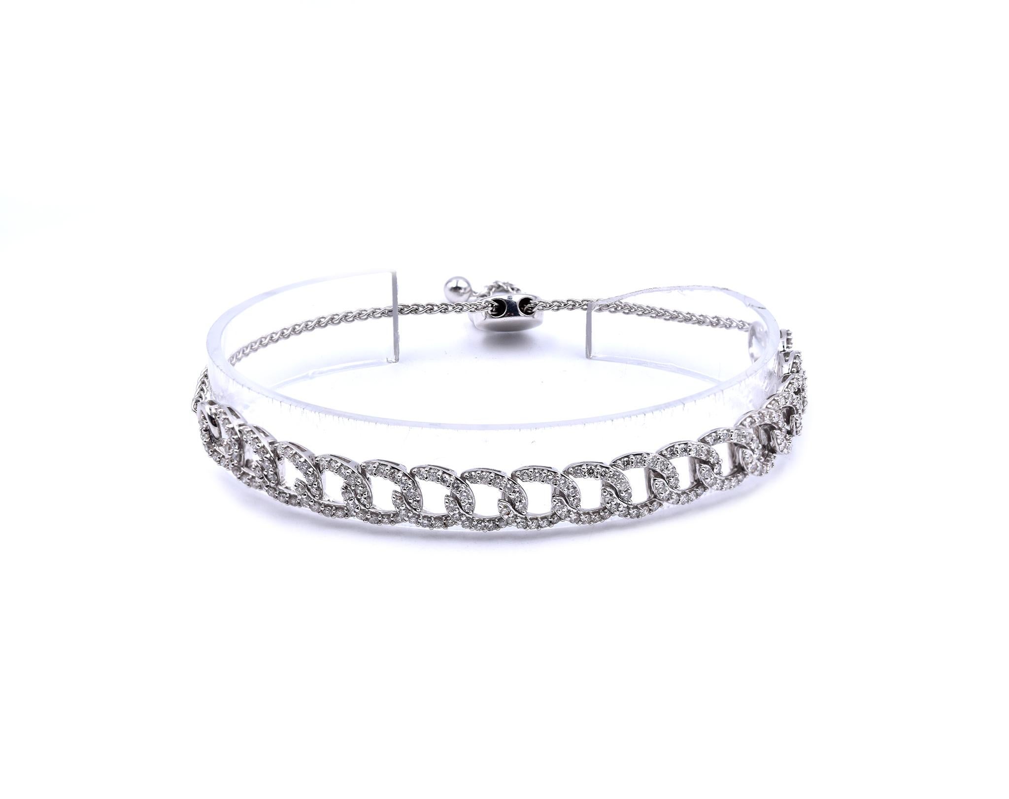 Designer: custom
Material: 10K white gold
Round Diamonds: 204 round brilliant cuts = 2.0cttw
Color: G
Clarity: VS
Dimensions: the bracelet measures 4.25 inches in length 
Weight: 11.39 grams