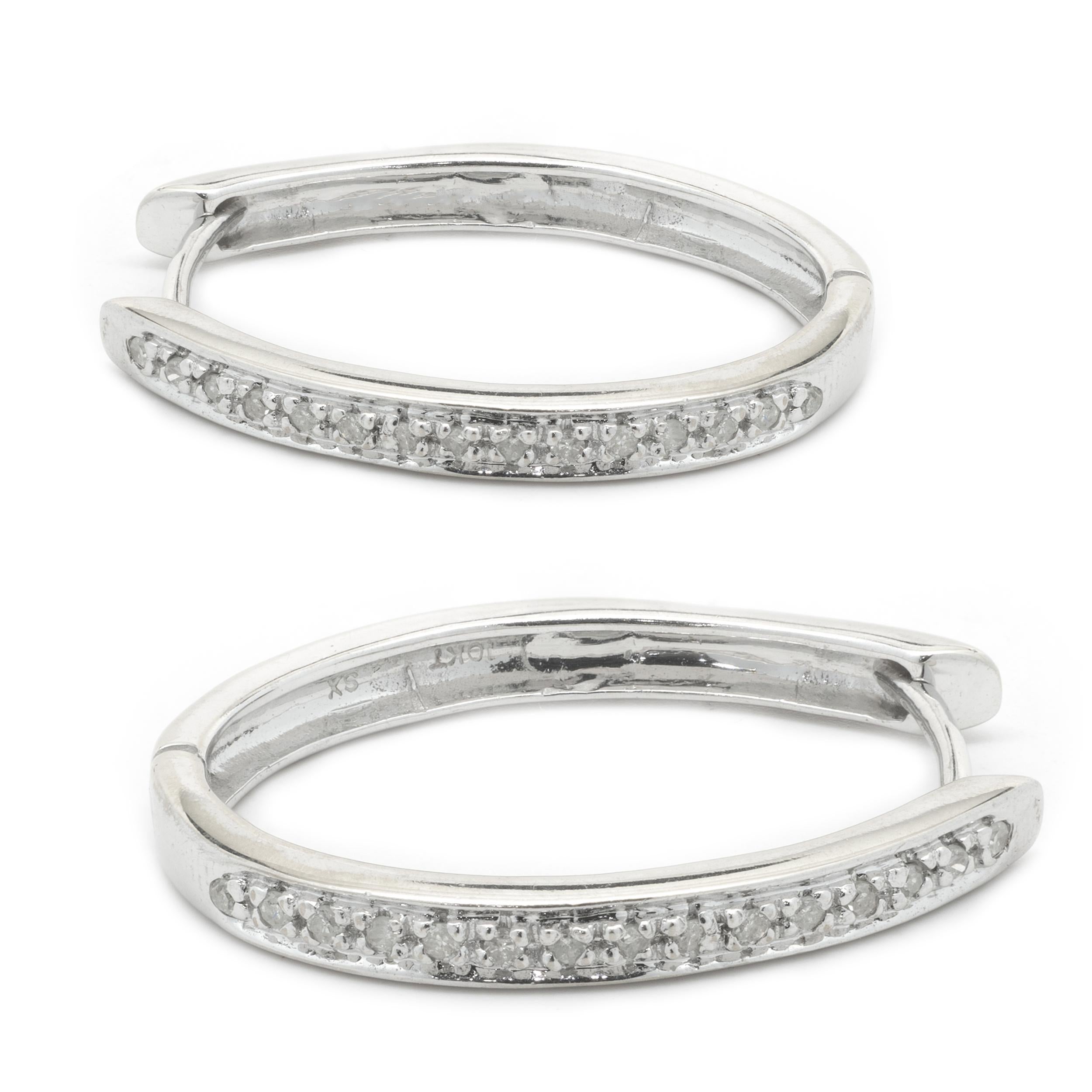Designer: custom design
Material: 10k white gold
Diamonds: 28 round cut = 0.28cttw
Color: I
Clarity: I2
Dimensions: earrings measure 24.6 X 2.78mm 
Fastenings: snapbacks
Weight: 4.60 grams
