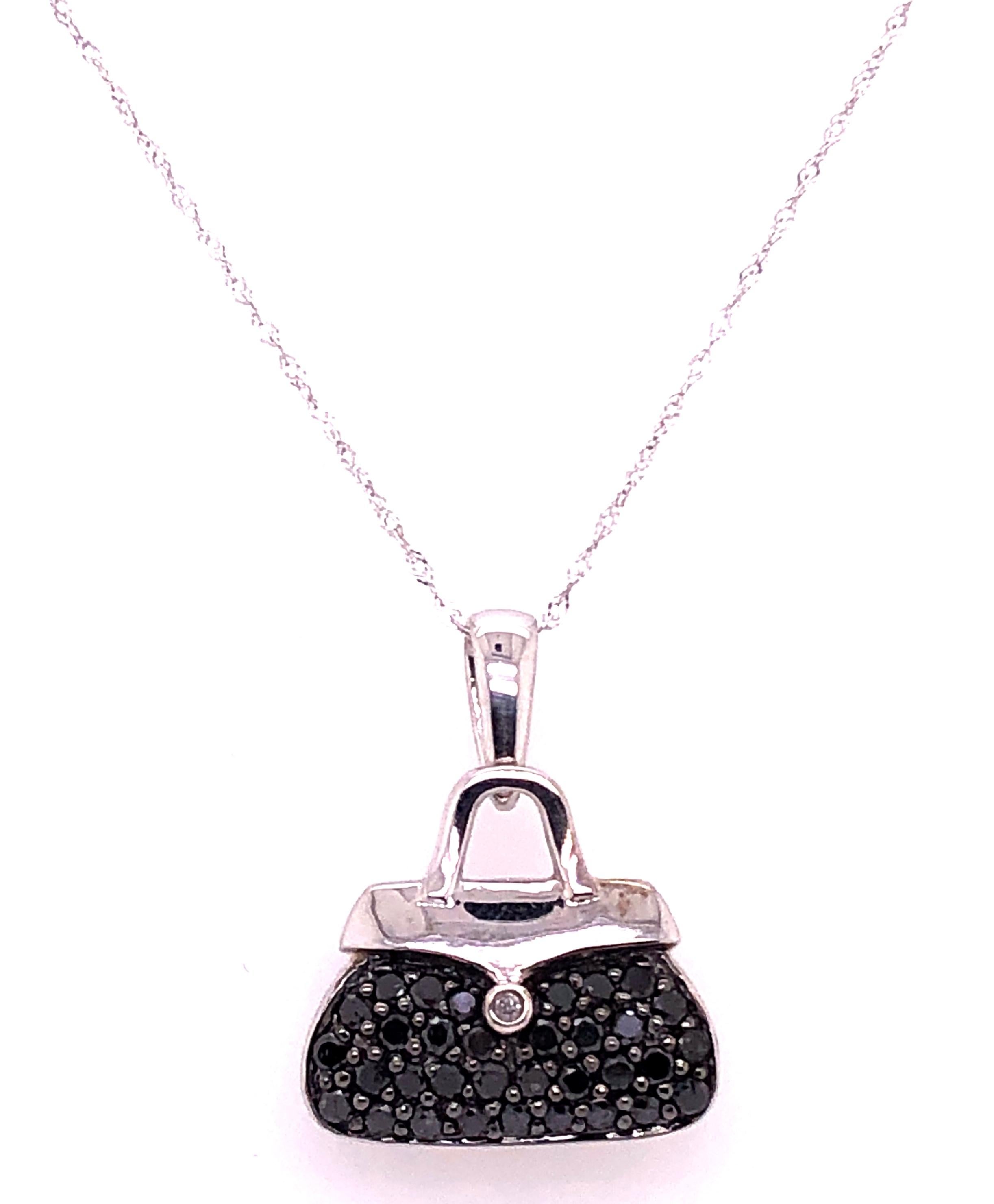 10 Karat White Gold Free Form 16 Inch Necklace and Fancy Pendant with Diamond. Sweet as can be. A perfect gift. 
0.01 total diamond weight.
4.64 grams total weight.
Pendant stamped 10K Made in China and Chain Marked Made in Turkey.