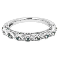 Anillo contorneado de oro blanco de 10 quilates con diamantes azules irradiados