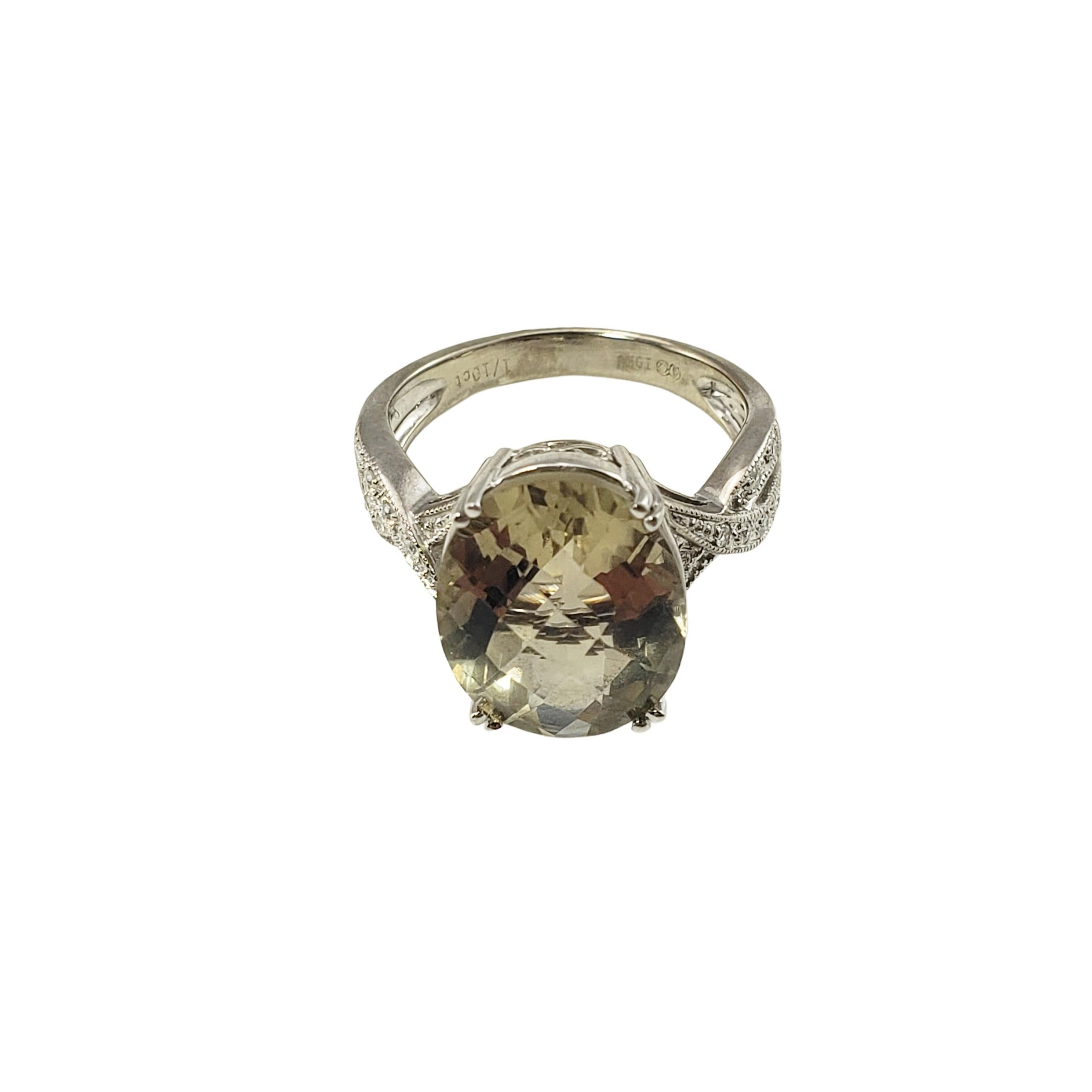 10 Karat White Gold Peridot and Diamond Ring Size 5.75 GAI Certified-

This stunning ring features one oval peridot (14 mm x 11 mm) and 12 round brilliant cut diamonds set in classic 10K white gold.  
Shank:  2 mm.

Total diamond weight:   .10