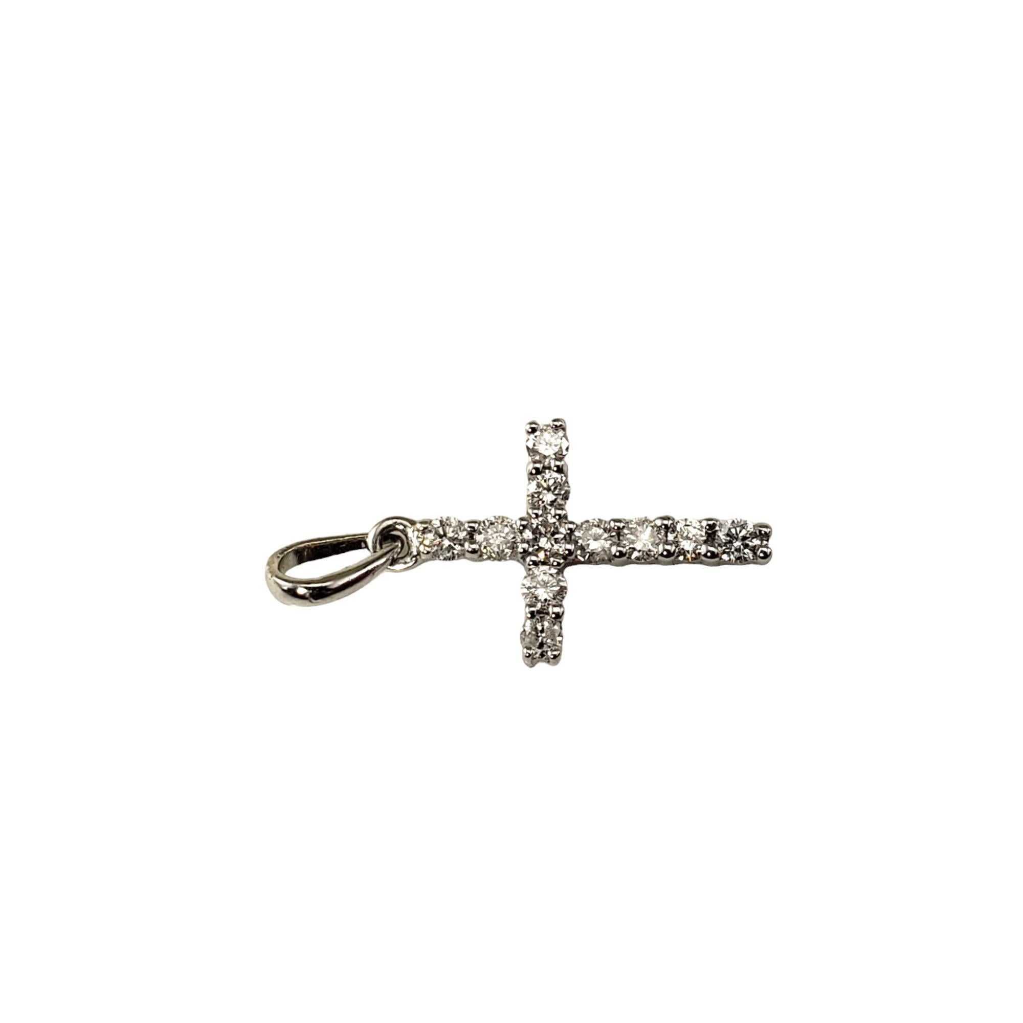 10 Karat White Gold Diamond Cross Pendant-

This sparkling cross pendant features 11 round brilliant cut diamonds set in classic 10K white gold.

Approximate total diamond weight: .15 ct.

Diamond color: H-I

Diamond clarity: I1-I2

Size: 15 mm x 9