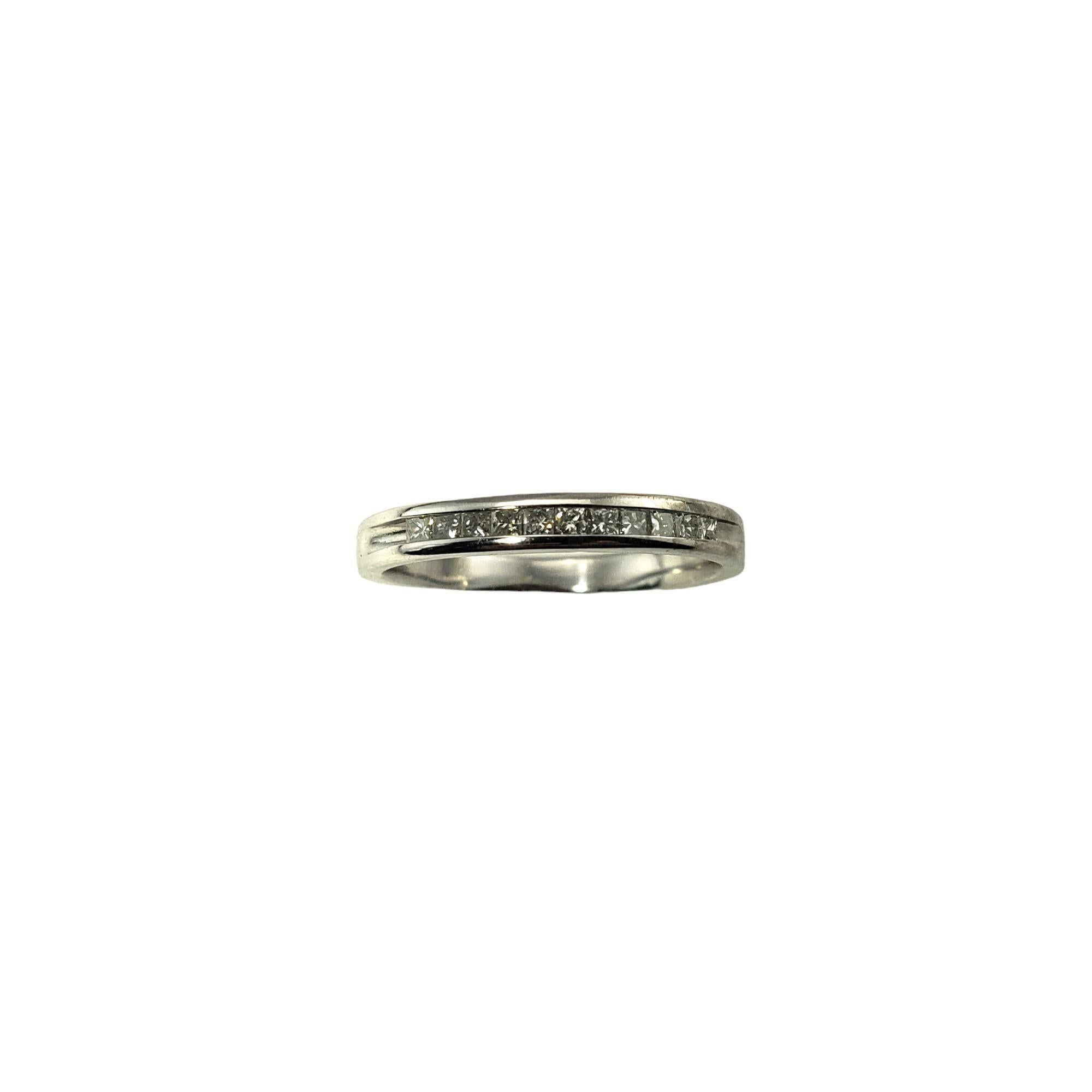 This sparkling band features ten princess cut diamonds set in classic 10K white gold.  Width:  2.5 mm.

Approximate total diamond weight:  .10 ct.

Diamond clarity: SI1-I1

Diamond color: I-J

Ring Size: 5.75

Weight:  1.2 dwt. /  1.9 gr.

Tested