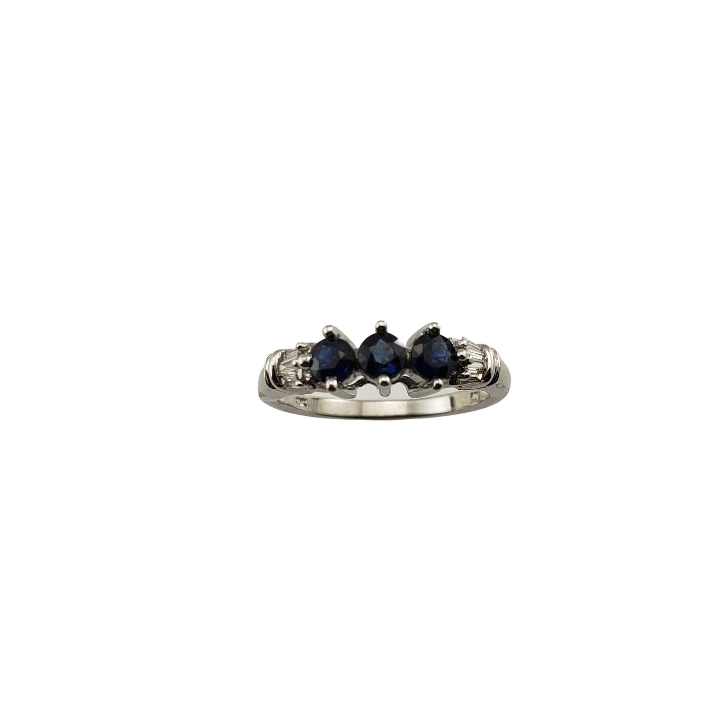 10 Karat White Gold Natural Sapphire and Diamond Ring Size 7-

This lovely ring features three round sapphires (4 mm each) and six baguette diamonds set in classic 10K white gold.
Width:  5 mm.  Shank: 2 mm.

Approximate total diamond weight:  .12