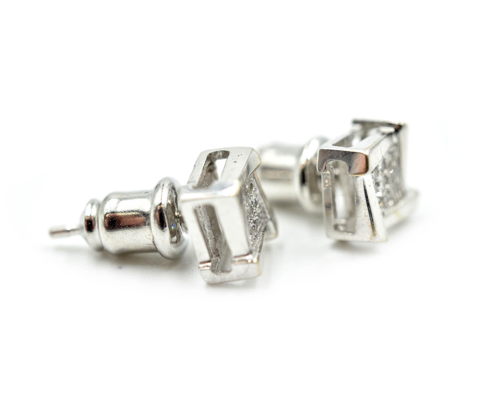 This pair of studs features round diamonds set in a high polished 10k white gold setting. The diamonds weigh 0.09 carats. Each stud measures 6.17mm in diameter. The pair of earrings is secured with friction back fastenings. The weight of the studs