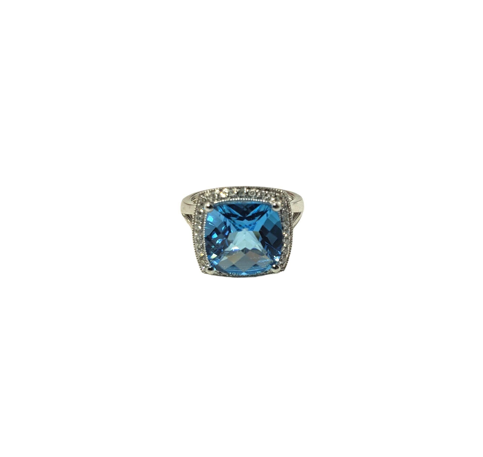 Vintage 10 Karat Topaz and Diamond Ring Size 5.75-

This stunning ring features one cushion cut blue topaz (11 mm x 11 mm) and 32 round single cut diamonds set in classic 10K white gold. Width: 14 mm. Shank: 2 mm.

Topaz weight: 7.18 ct.

Total