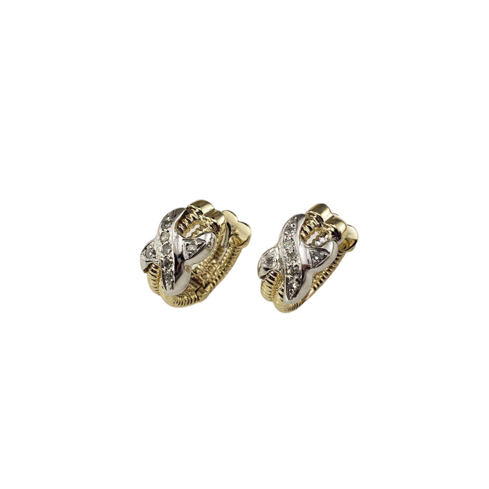 10K Yellow Gold White Gold and Diamond Hoop X Earrings

These lovely earrings each feature seven round single cut diamonds set in beautifully detailed 10K yellow and white gold.

 Width: 7 mm.

Approximate total diamond weight: .10 ct.

Diamond