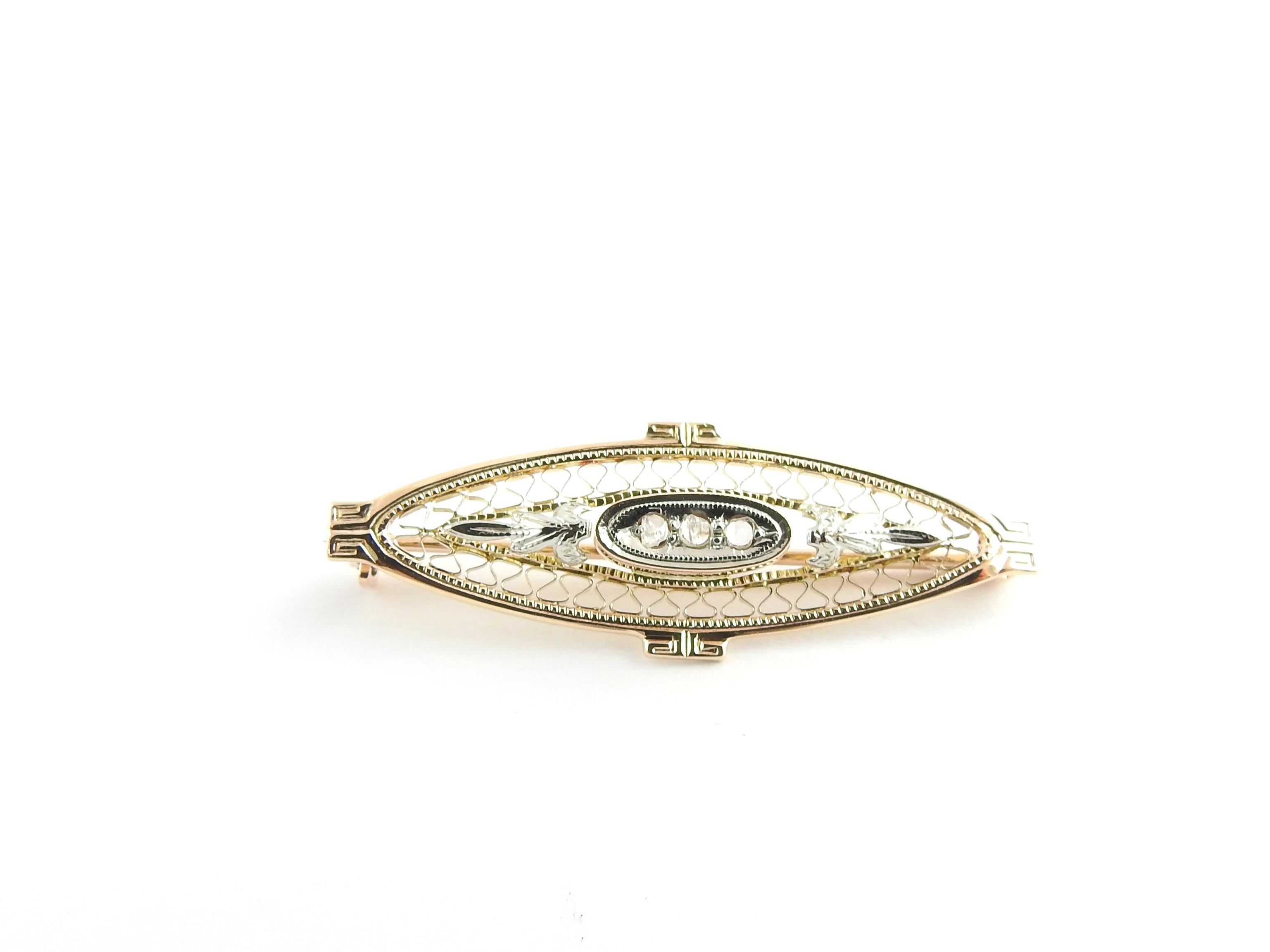 Vintage 10 Karat Yellow and White Gold Filigree and Diamond Brooch/Pin

This lovely brooch features three rose cut diamonds set in beautifully detailed yellow and white gold filigree.

Diamond color: I

Diamond clarity: I1

Size: 38 mm x 13