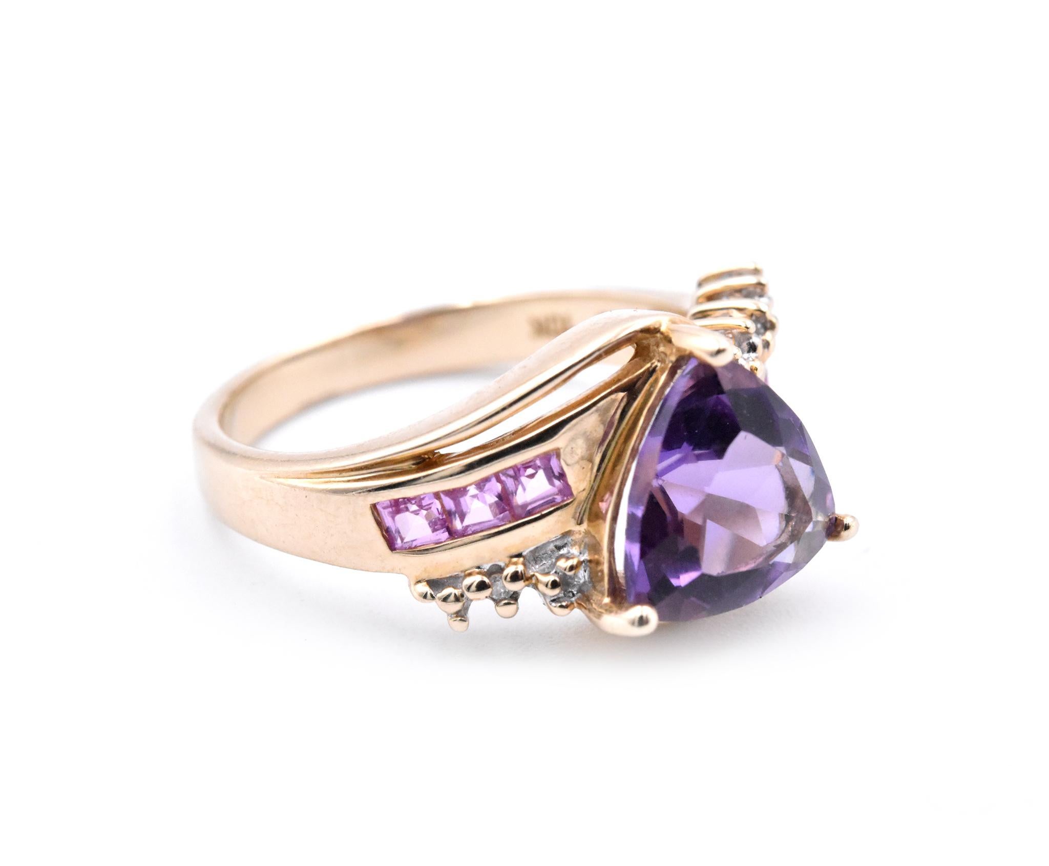 Designer: custom design
Material: 10 karat yellow gold
Gemstones: Amethyst = 2.12ct Trillion
Certification: AGI 25348
Diamonds: .015cttw
Color: H
Clarity: SI2
Ring Size: 7.5 (please allow two additional shipping days for sizing requests)
Dimensions: