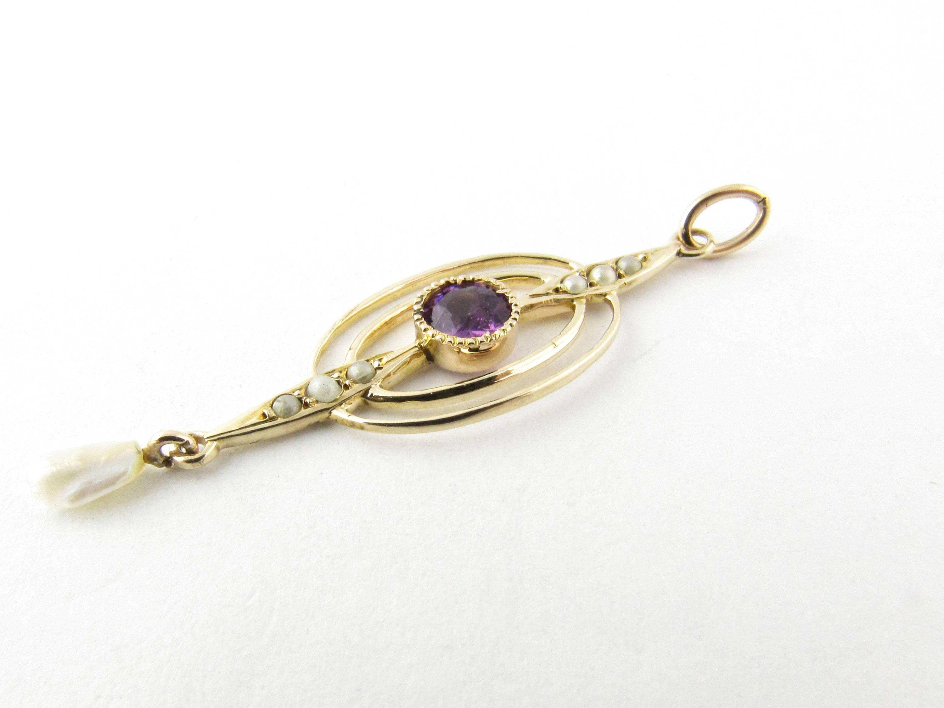 Vintage 10 Karat Yellow Gold Amethyst and Pearl Pendant-

This delicate pendant features on round amethyst (5 mm) and accented with six seed pearls and one dangling fresh water pearl. Beautifully detailed in 10K yellow gold. 
Size: 33 mm x 12 mm