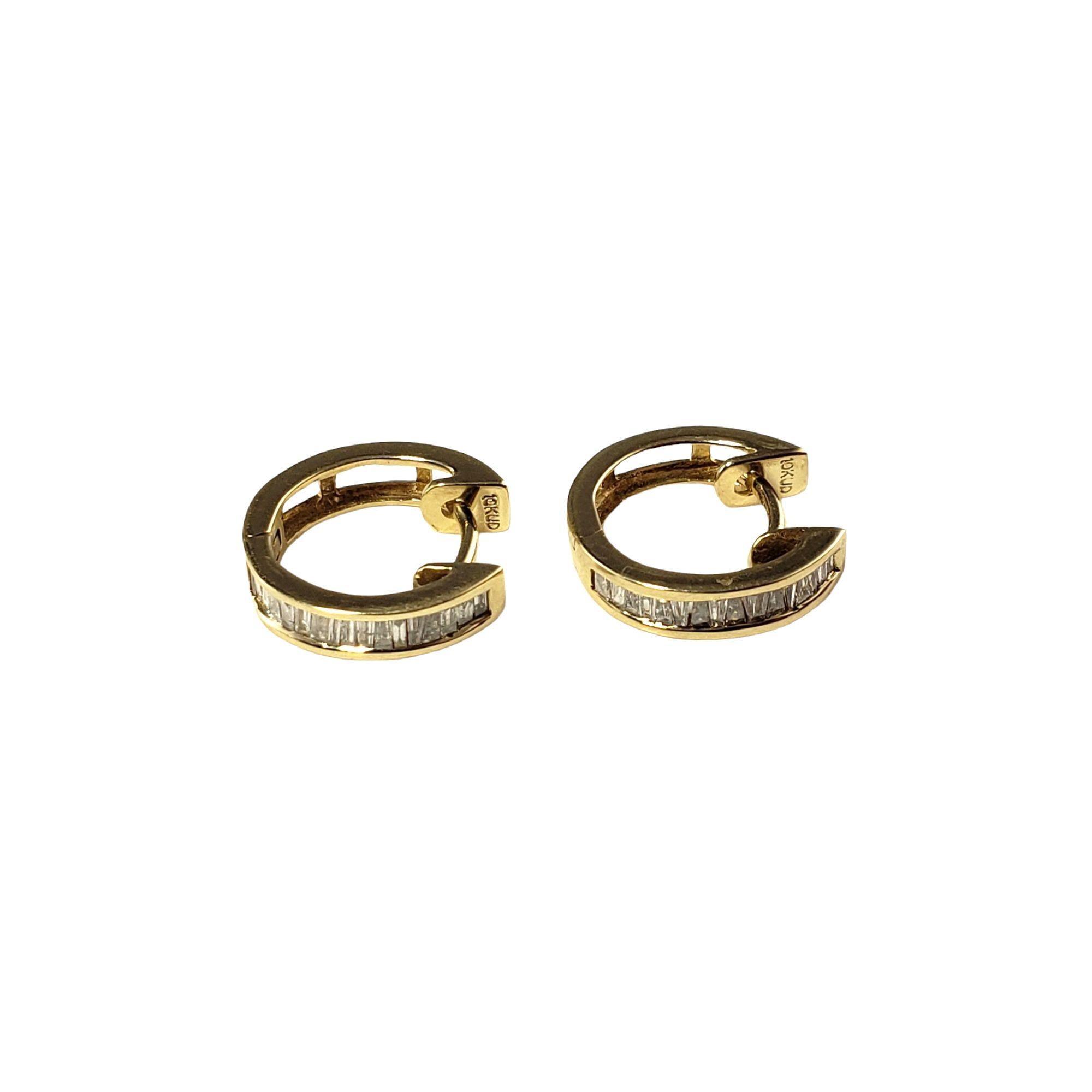 Vintage 10 Karat Yellow Gold and Diamond Hoop Earrings-

These lovely hinged hoop earrings are decorated with sparkling baguette diamonds set in classic 10K yellow gold.

Approximate total diamond weight: .48 ct.

Diamond color: I

Diamond clarity: