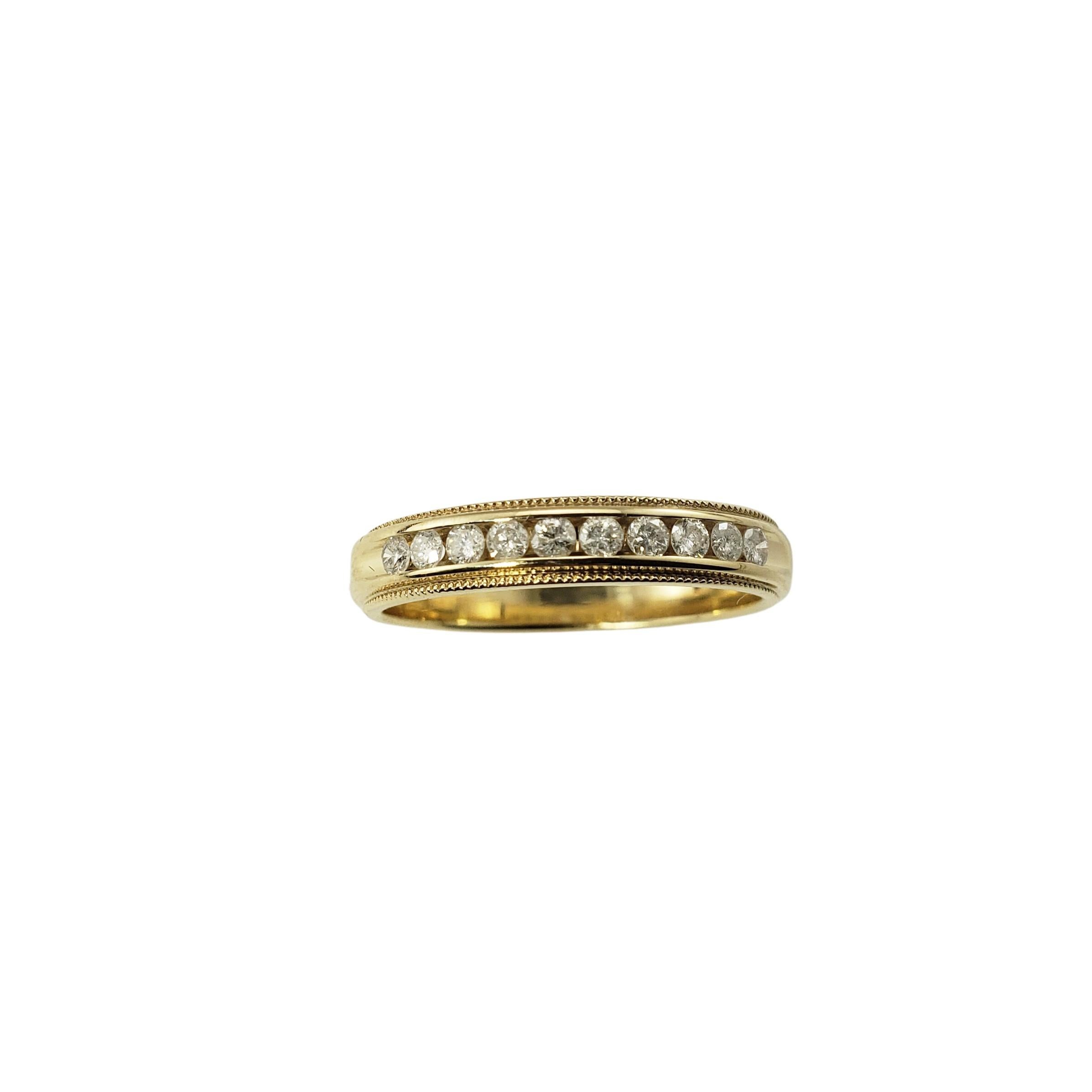 10 Karat Yellow Gold and Diamond Wedding Band Ring Size 7.5-

This sparkling wedding band features ten round brilliant cut diamonds set in classic 14K yellow gold.  Width:  4 mm.  Shank: 3.5 mm.

Approximate total diamond weight:  .20 ct.

Diamond