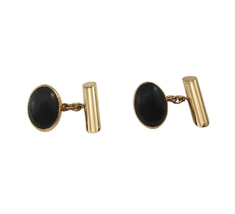 10 Karat Yellow Gold and Onyx Cufflinks-

These elegant cufflinks each feature one oval onyx stone (15 mm x 10 mm) set in classic 10K yellow gold.  

Size:  15 mm x 10 mm

Weight:   3.4 dwt. /   5.3 gr.

Stamped: 10K

Very good condition,