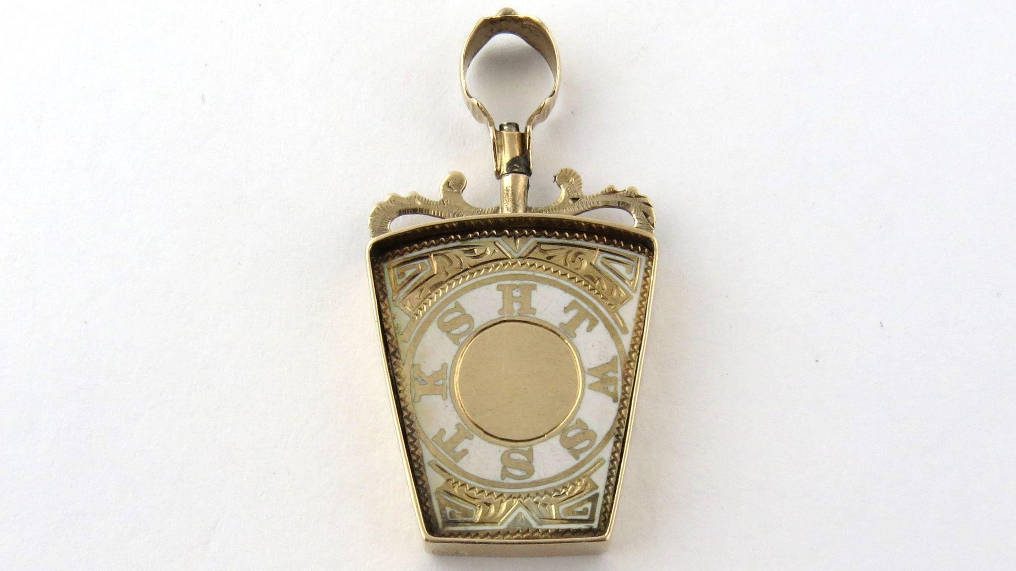 Vintage 10K Yellow Gold and White Enamel Masonic Royal Arch Keystone FOB 

This vintage piece has hand engraved details and bail screws on a base metal post which attaches it to the frame. The letters HTWSSTKS are gold engraved on the white enamel