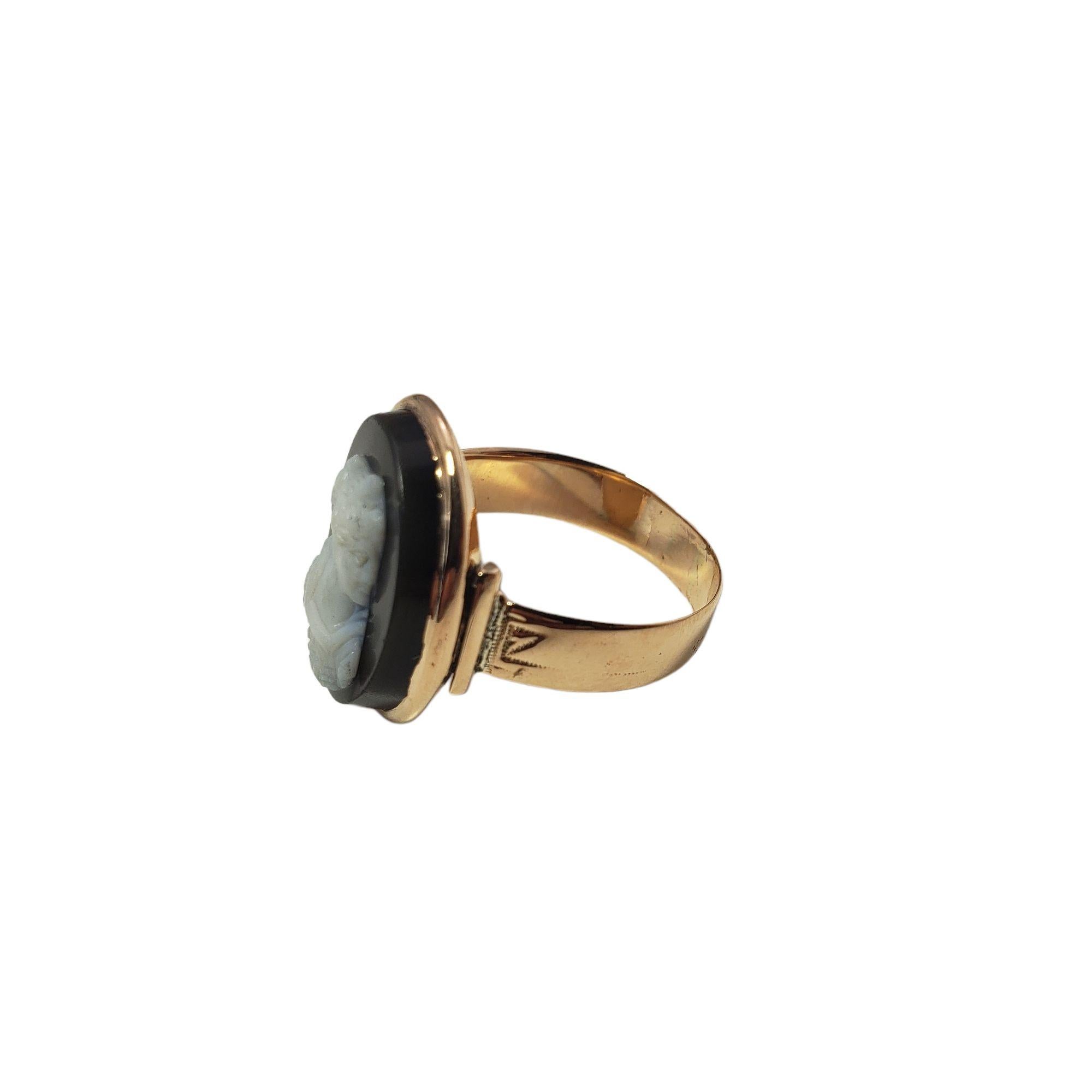 Vintage 10 Karat Yellow Gold Black Cameo Ring Size 7-

This elegant black cameo ring features a lovely lady in profile set in 10K yellow gold. Width: 19 mm. Shank: 4 mm.

Ring Size: 7

Weight: 1.4 dwt. / 2.3 gr.

Tested 10K gold.

Very good