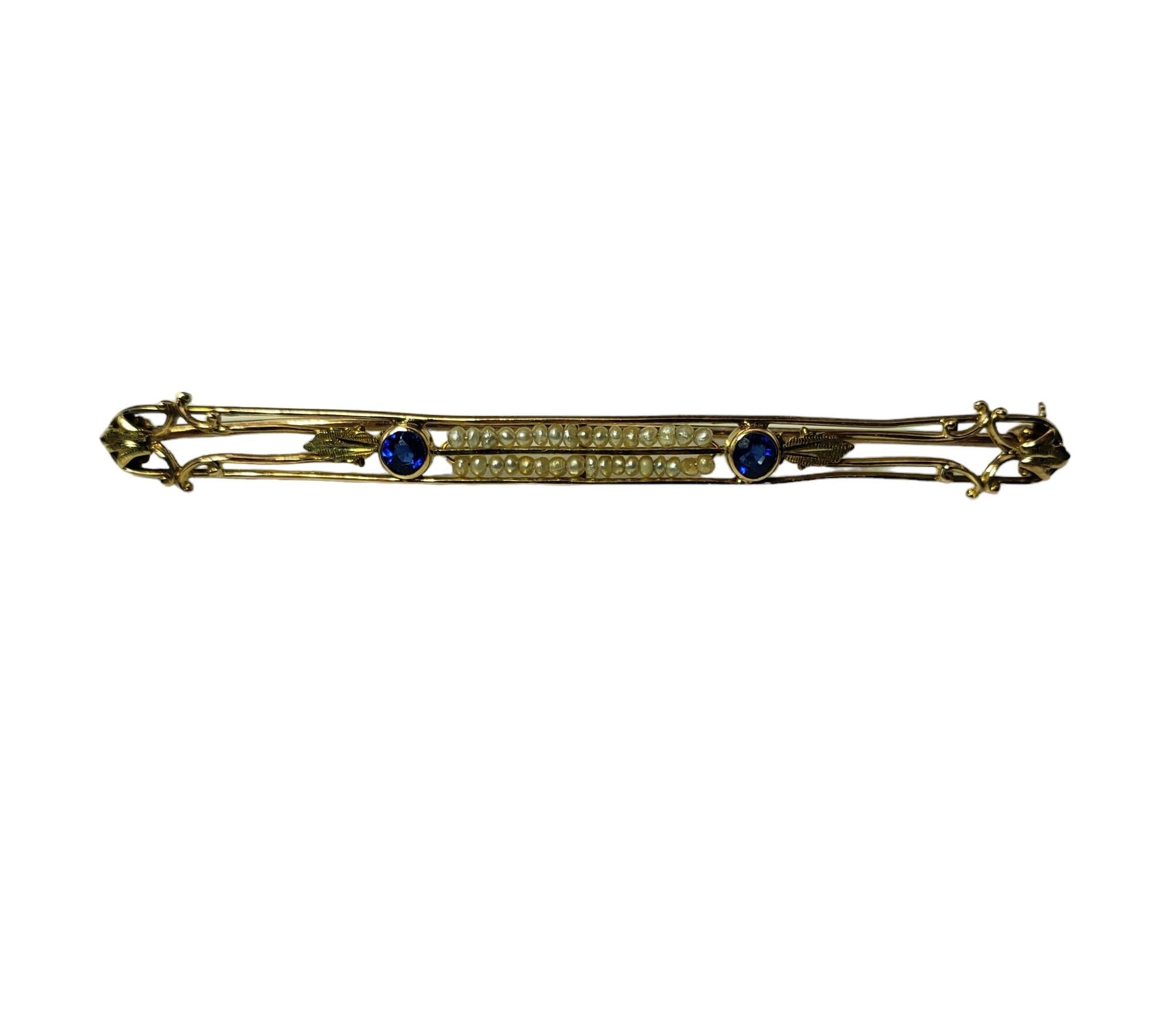 Vintage 10K Yellow Gold Blue Glass and Seed Pearl Pin-

This elegant pin is detailed with two blue glass stones and 34 seed pearls set in beautifully detailed 10K yellow gold.

Size: 64.6 mm x 4.9 mm

Stamped: MARATHON 10K

Weight: 2.6 gr./ 1.6