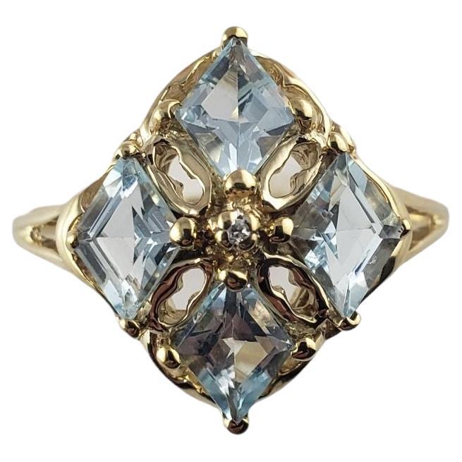 10 Karat Yellow Gold Blue Topaz and Diamond Ring #14036 For Sale