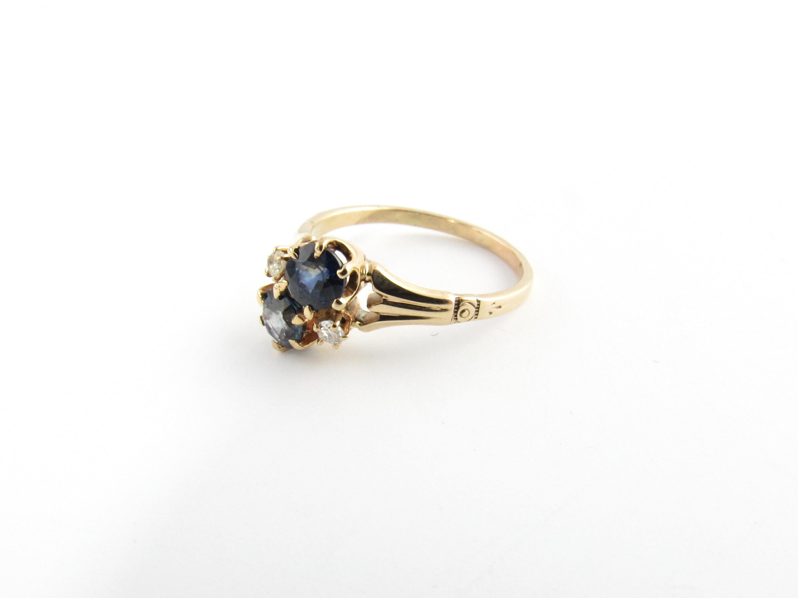 10 Karat Yellow Gold Blue Topaz and Diamond Ring Size 4.75-

This lovely ring features two round blue topaz stones (5 mm each) and tow round brilliant cut diamonds set in classic 10K yellow gold.  Shank measures 1 mm.

Approximate total diamond