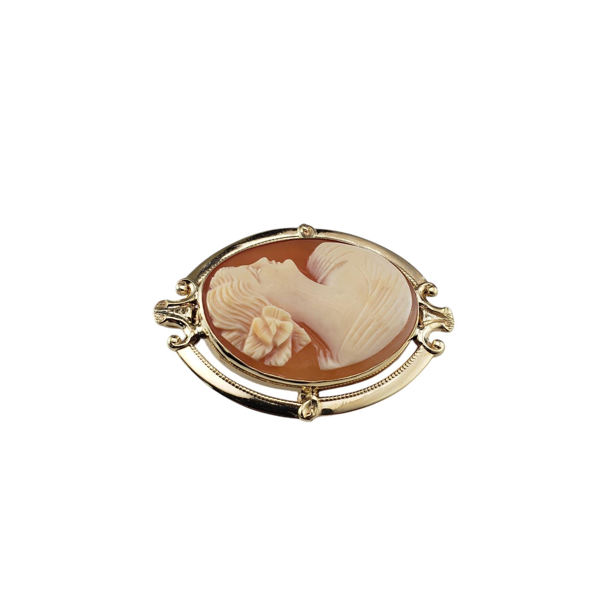 10 Karat Yellow Gold Cameo Brooch/Pendant-

This stunning cameo features a lovely lady in profile set in beautifully detailed 10K yellow gold. Can be worn as a brooch or a pendant.

Size: 42 mm x 31 mm

Weight: 4.8 dwt./7.4 gr.

Stamped: 10K

Very