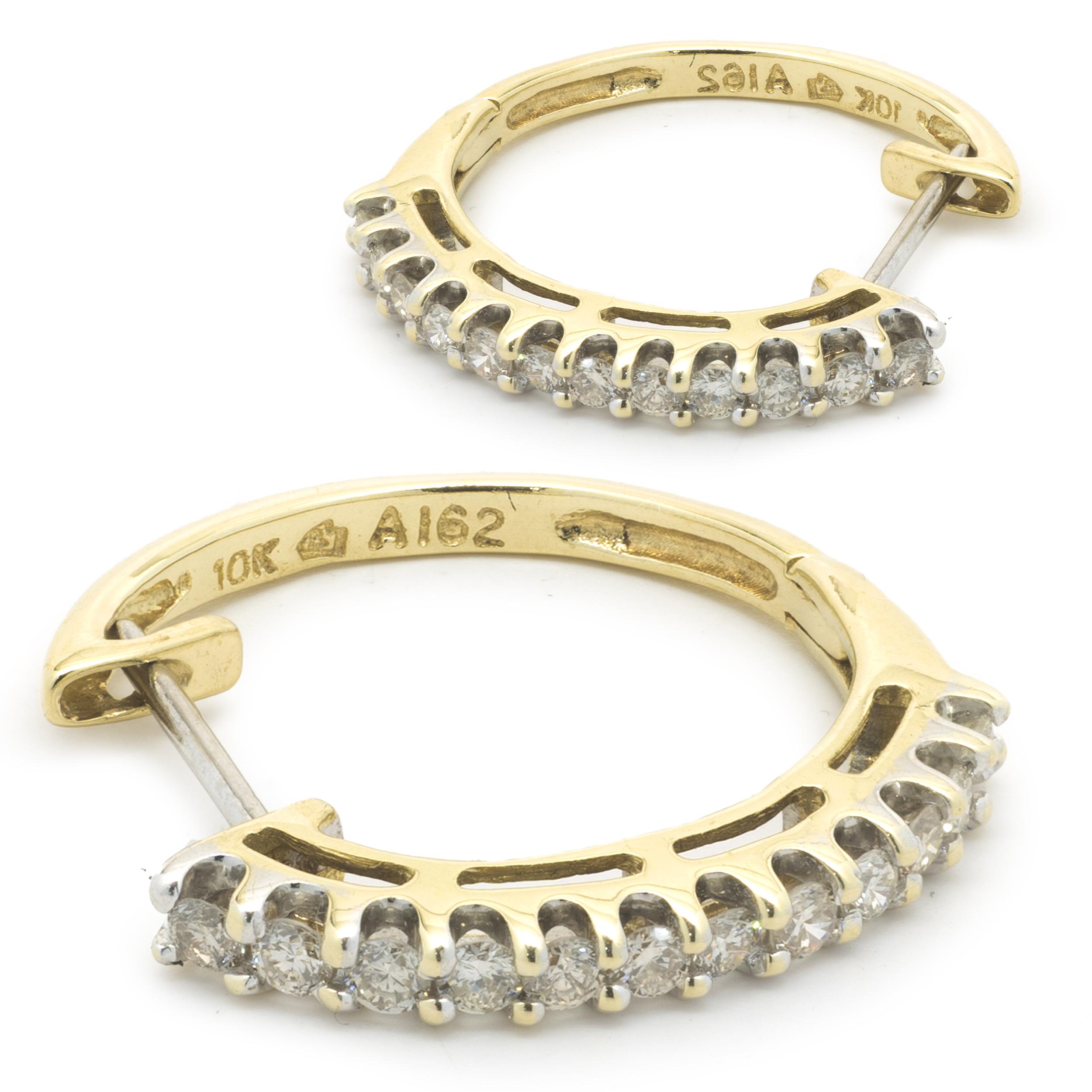 Designer: custom design
Material: 10K yellow gold
Diamonds: 24 round cut = .50cttw
Color: champagne 
Clarity: SI1
Dimensions: earrings measure 19.40 X 2.60mm
Fastenings: post with snap backs
Weight: 2.96 grams
