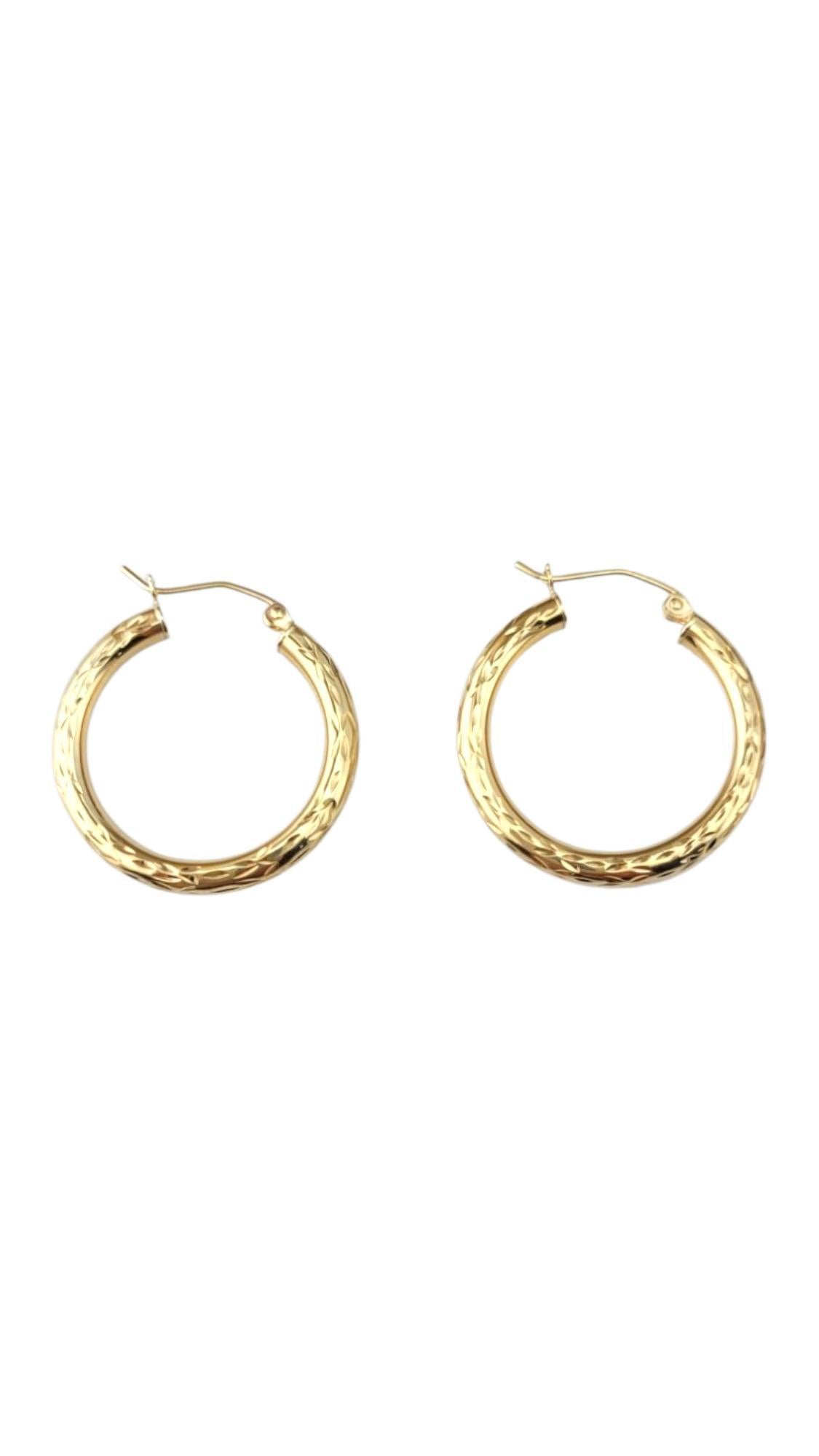 10 Karat Yellow Gold Diamond Cut Hoop Earrings

These classic hoop earrings, crafted in 10-karat yellow gold, feature a delicate engraved design that adds texture and charm. Their warm golden glow brings timeless elegance to any look, whether you're