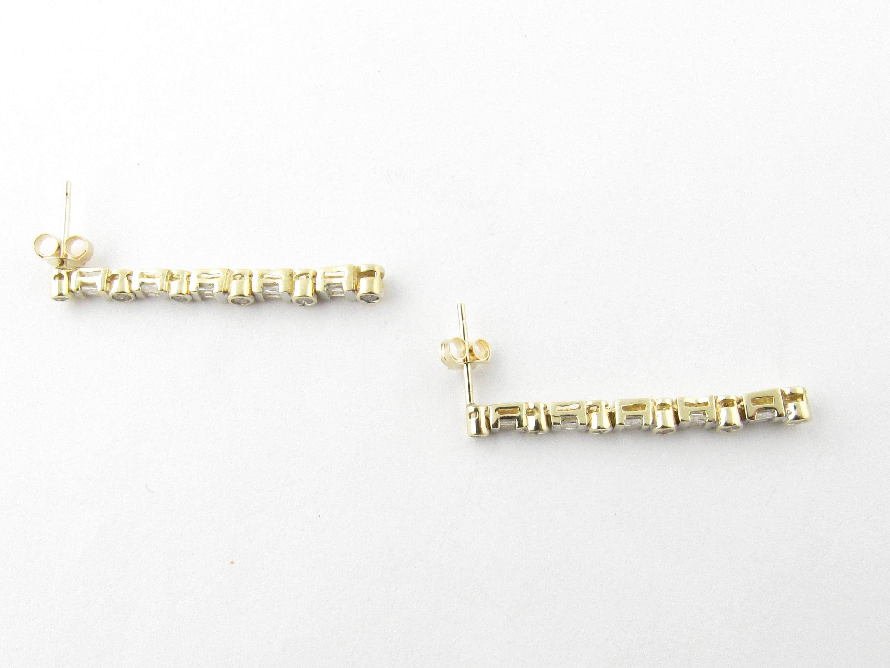 Vintage 10 Karat Yellow Gold Diamond Earrings-

These sparkling dangling earrings each feature six round brilliant cut diamonds (.20 ct. twt.) and 10 baguette diamonds (.40 ct. twt.) set in 10K yellow gold. Push back closures.

Approximate total