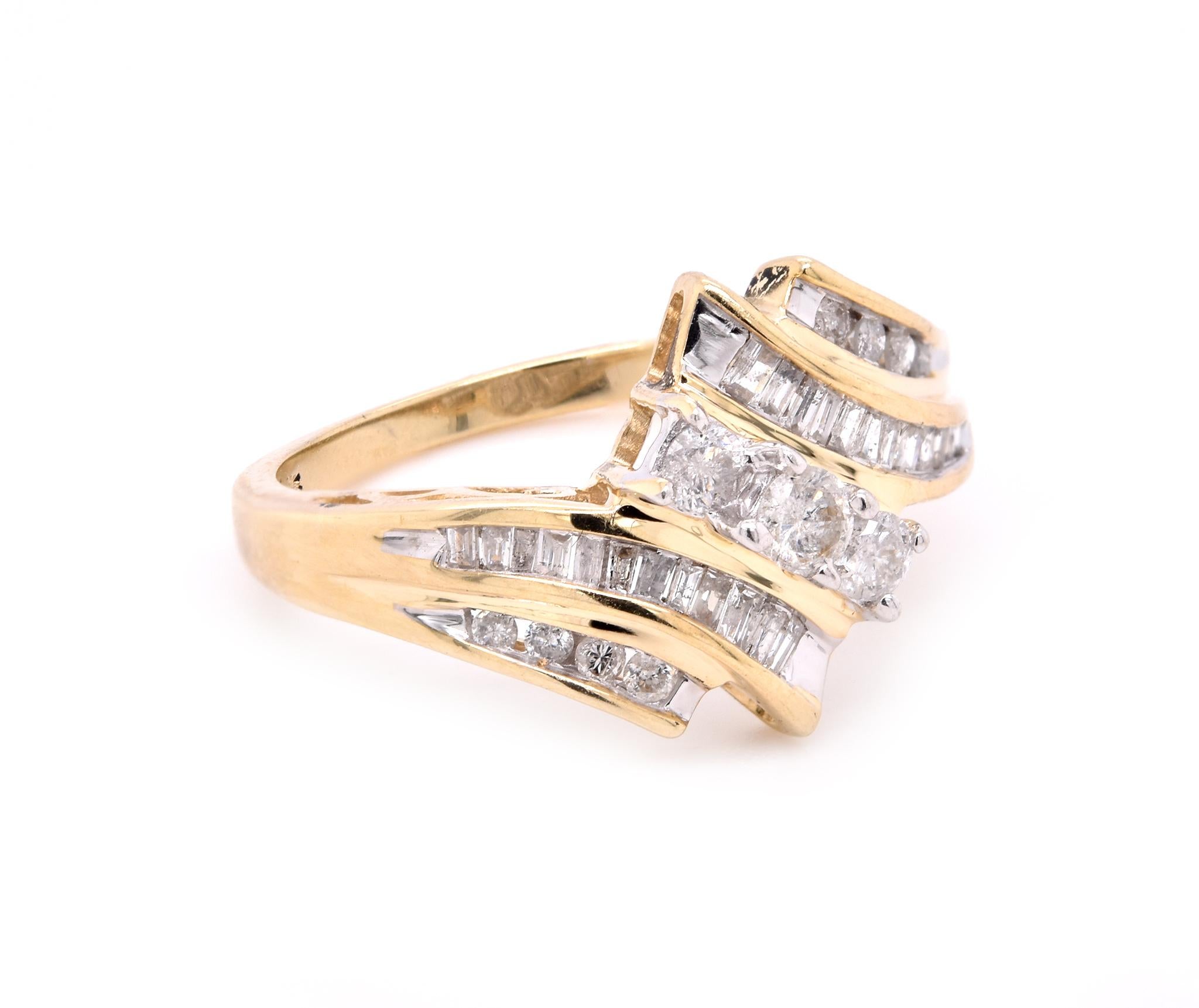 Designer: custom
Material: 10K yellow gold
Diamonds:  35 round & baguette cut = 1.00cttw
Color: H 
Clarity: SI2
Ring Size: 7 (Please allow up to two additional business days for sizing requests)
Dimensions: ring top measures 13.3mm wide
Weight: 2.98