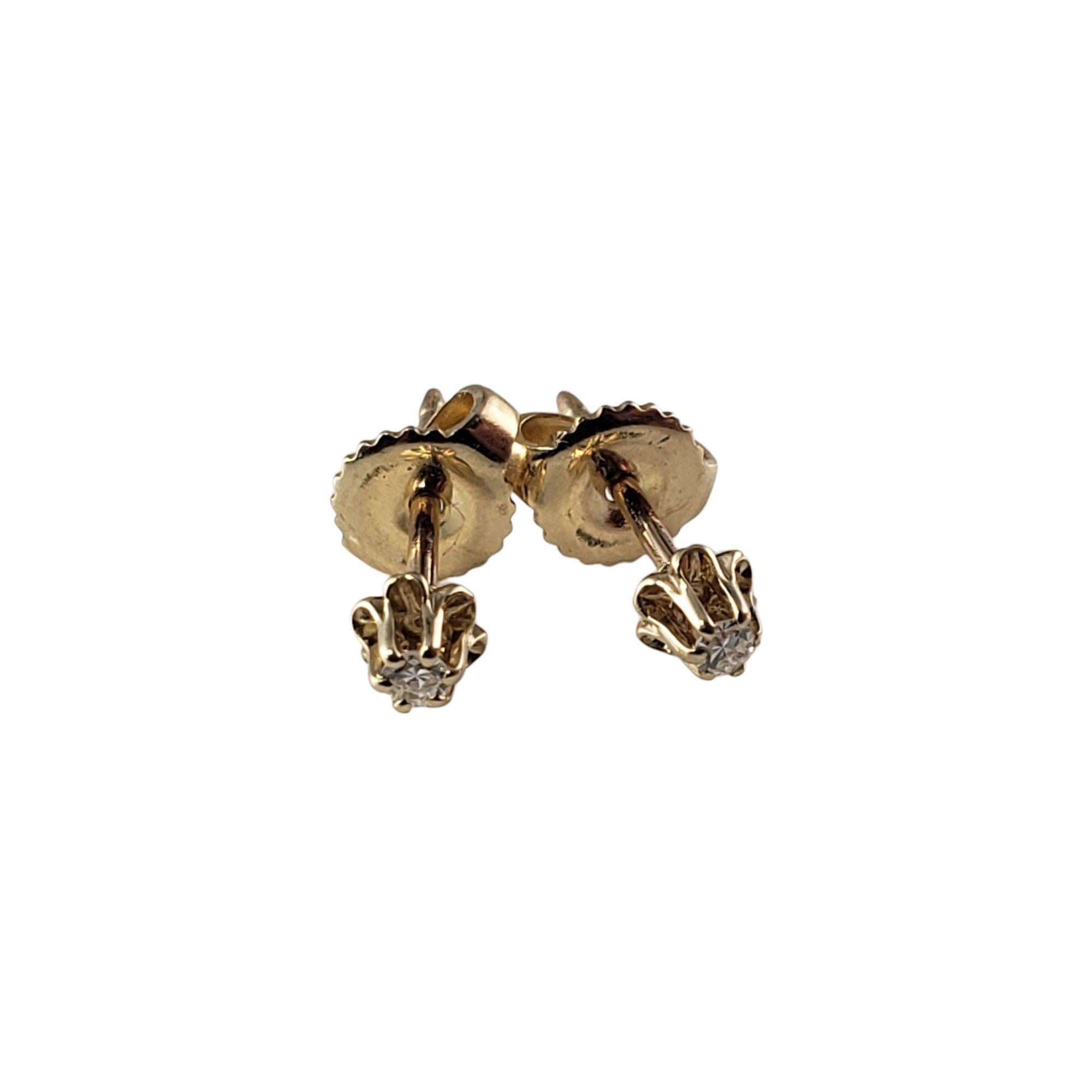 These sparkling earrings each feature one round single cut diamond set in 14K yellow gold.  Push back closures.

Approximate diamond weight: .04 ct.

Diamond color: H

Diamond clarity: VS1

Size:  3 mm

Weight:  1.0 gr./  0.6 dwt.

Tested 10K