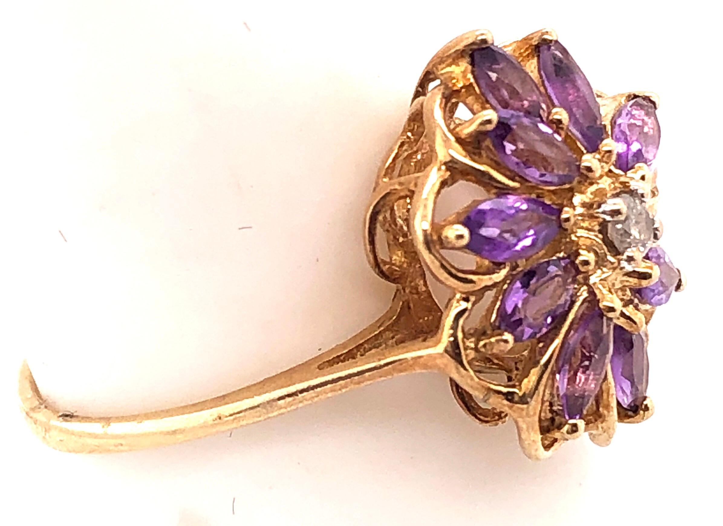 10 Karat Yellow Gold Fashion Oval Amethyst  Ring with  Round Diamond 0.03 TDW.
Size 8 
2.32 grams total weight.
