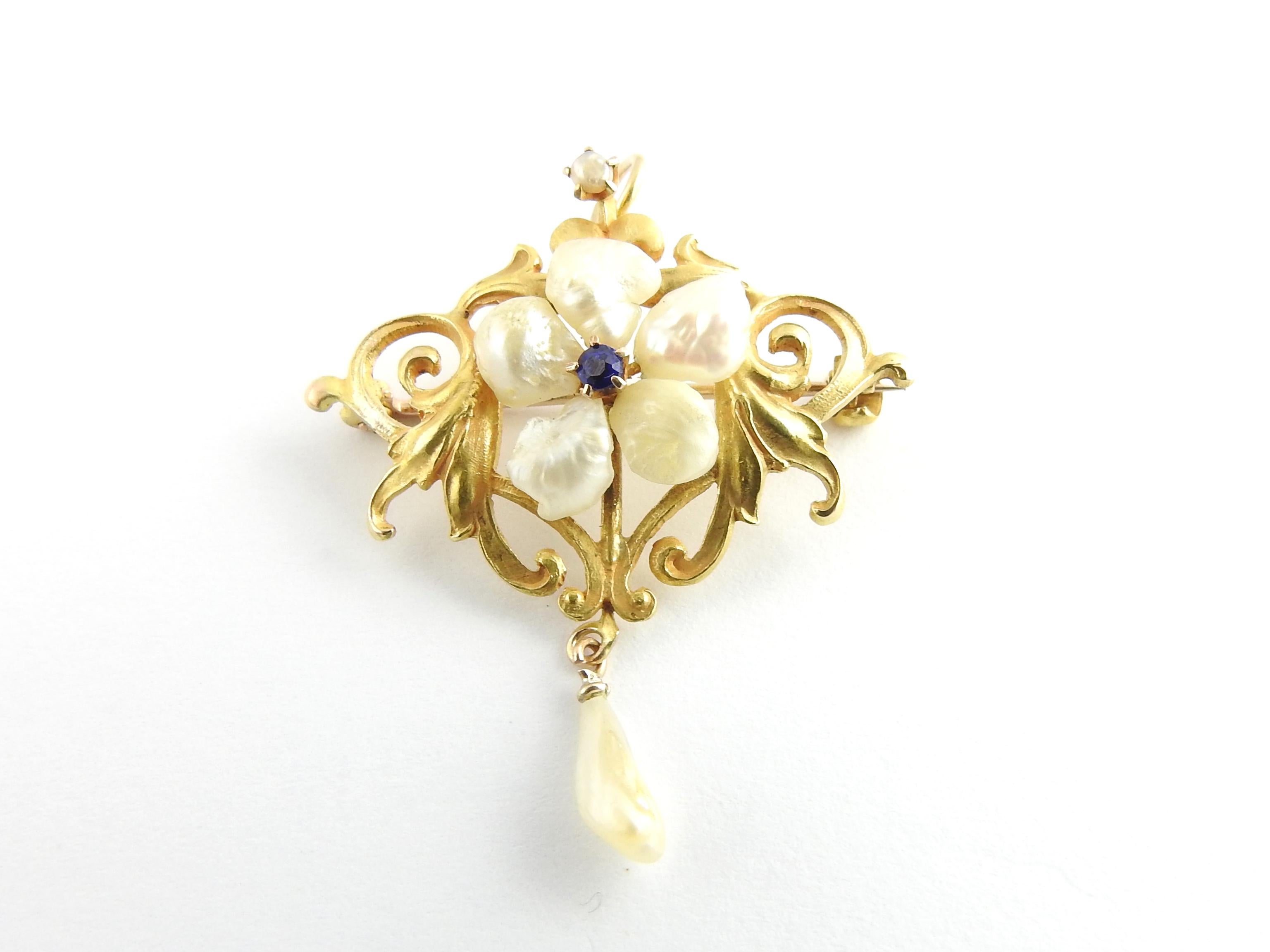 Vintage 10 Karat Yellow Gold Freshwater Pearl and Blue Stone Brooch/Pendant

This lovely piece features five freshwater pearls and one round blue stone crafted in beautifully detailed 10K yellow gold. Can be worn as a brooch or pendant.

Size: 25 mm
