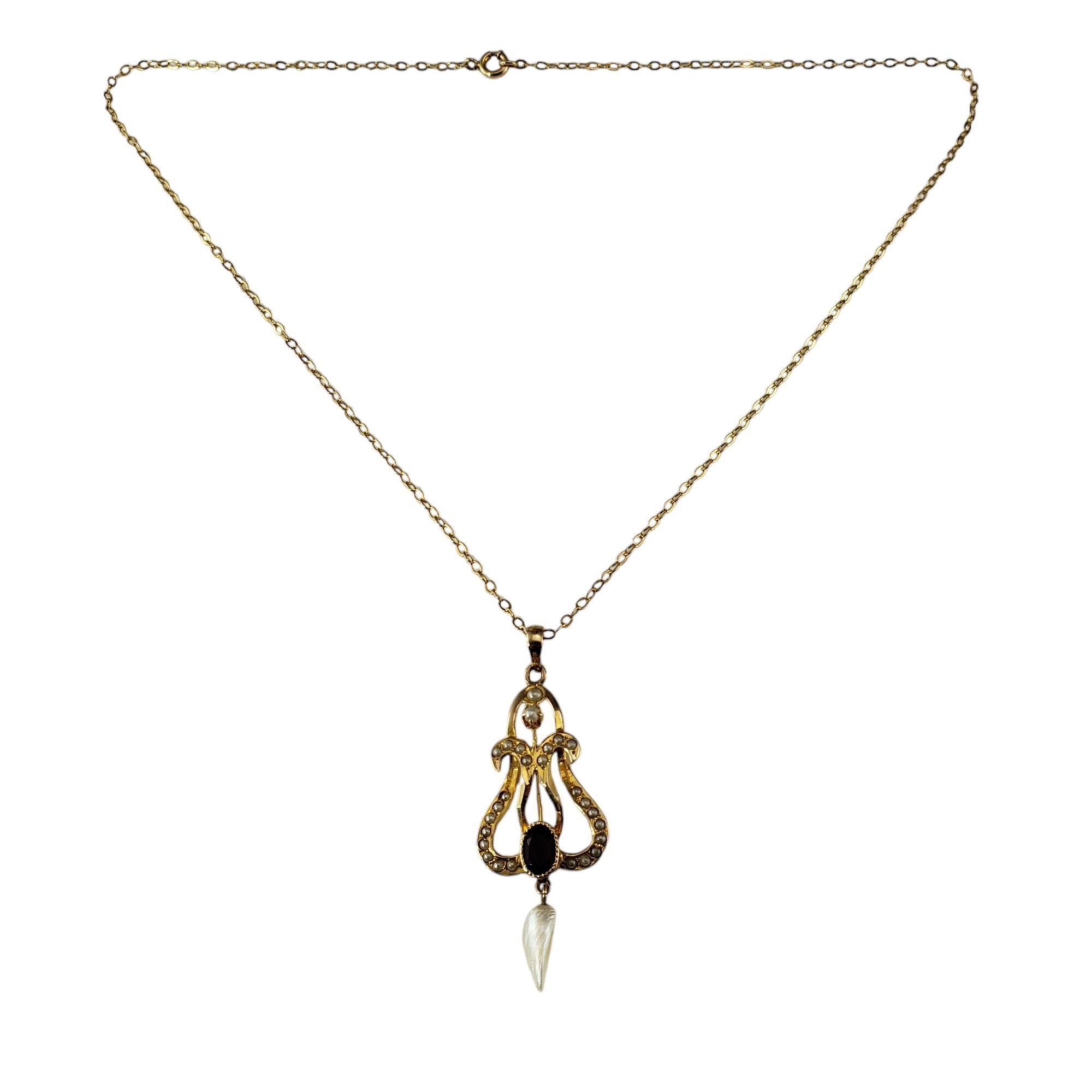 10 Karat Yellow Gold Freshwater Pearl Pendant Necklace-

These elegant pendant necklace is decorated with one purple faceted gemstone and freshwater pearls set in beautifully detailed 10K yellow gold.

Stamped: 10K

Size: 16 inches (necklace)
      