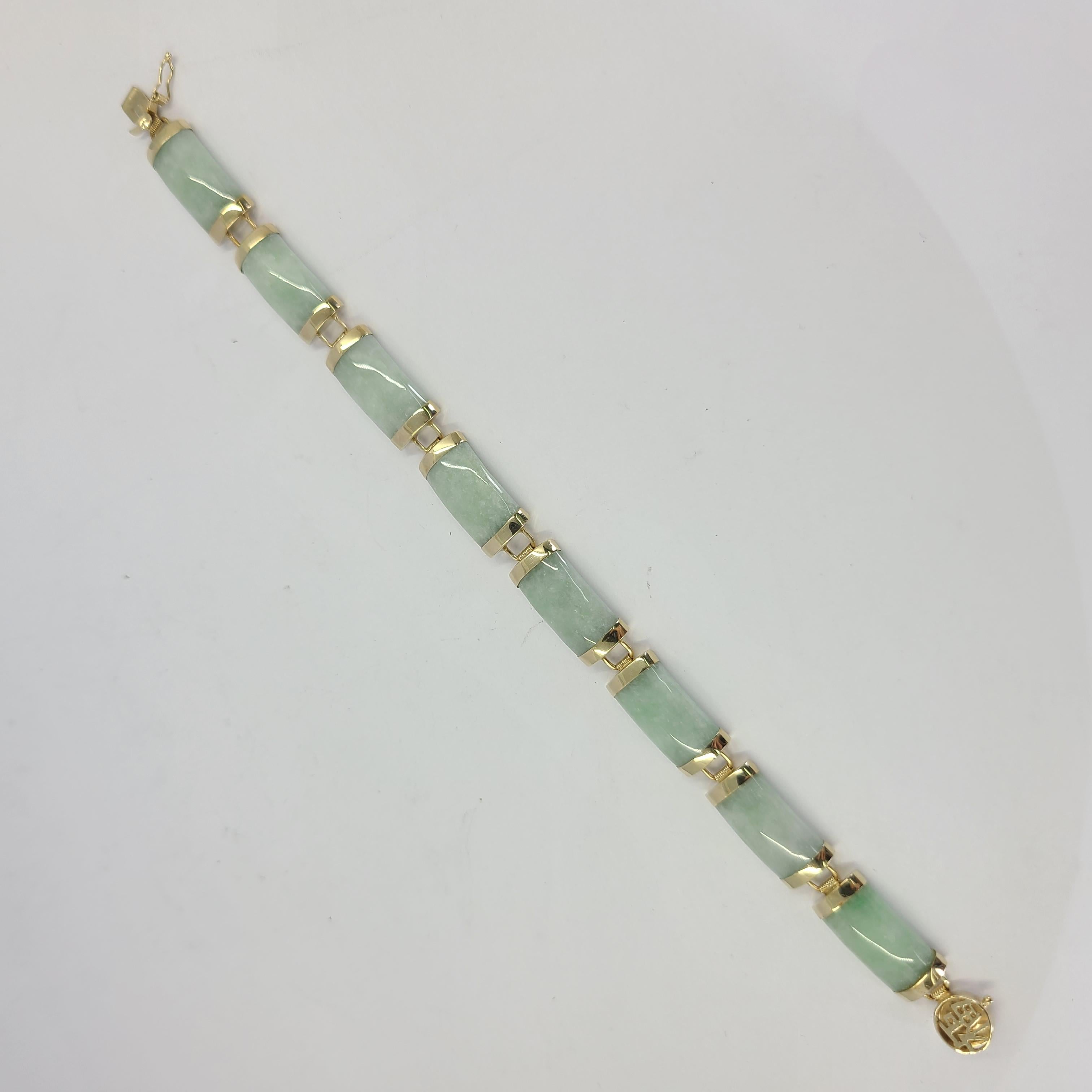 10 Karat Yellow Gold & Green Jade Bracelet Measuring 6 Inches Long. Asian Symbol On Clasp With Figure 8 Safety. Finished Weight Is 10.7 Grams. 