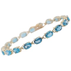 10 Karat Yellow Gold Light Blue Topaz Tennis Line Bracelet