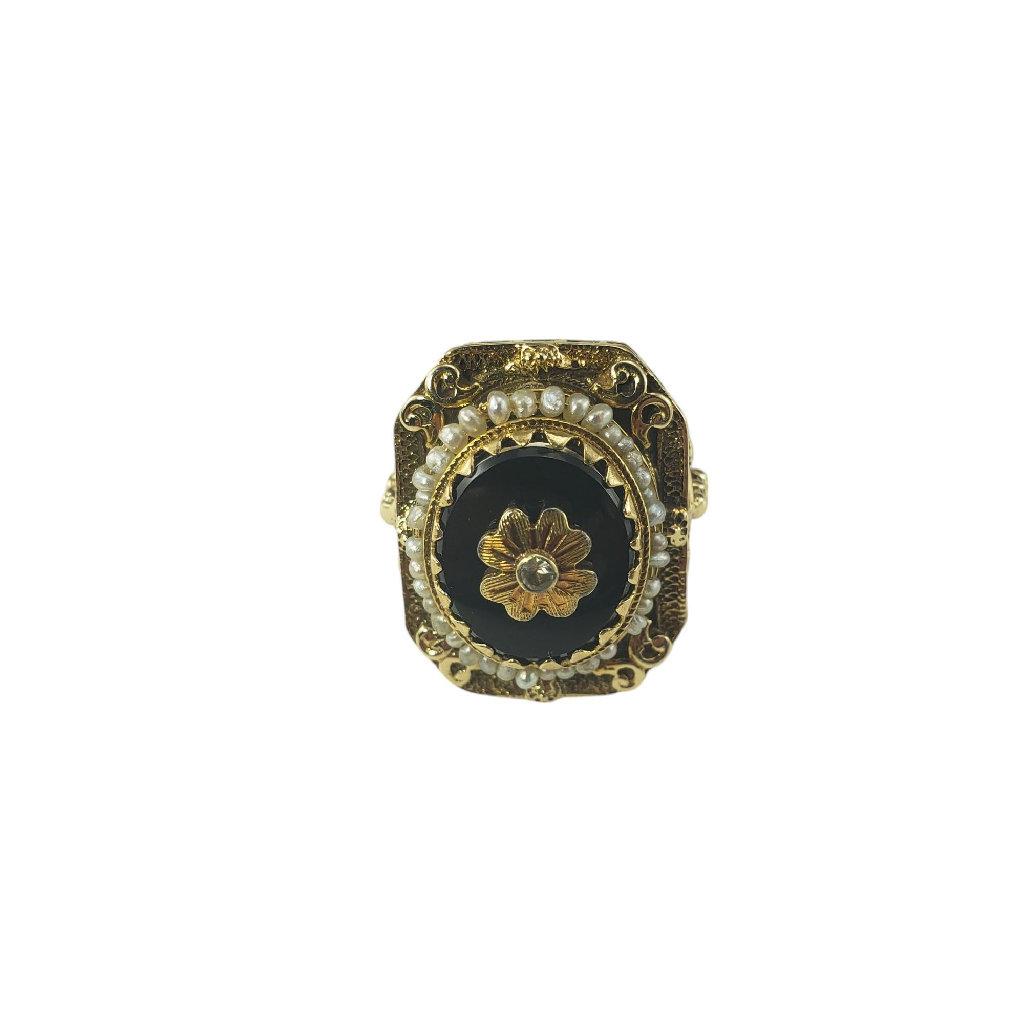 10 Karat Yellow Gold Onyx and Seed Pearl Ring Size 7

This elegant ring features one oval onyx stone (14 mm x 12.5 mm), 36 seed pearls and one clear stone set in meticulously detailed 10K yellow gold. 

 Top of ring measures 24 mm x 19 mm.  Shank: