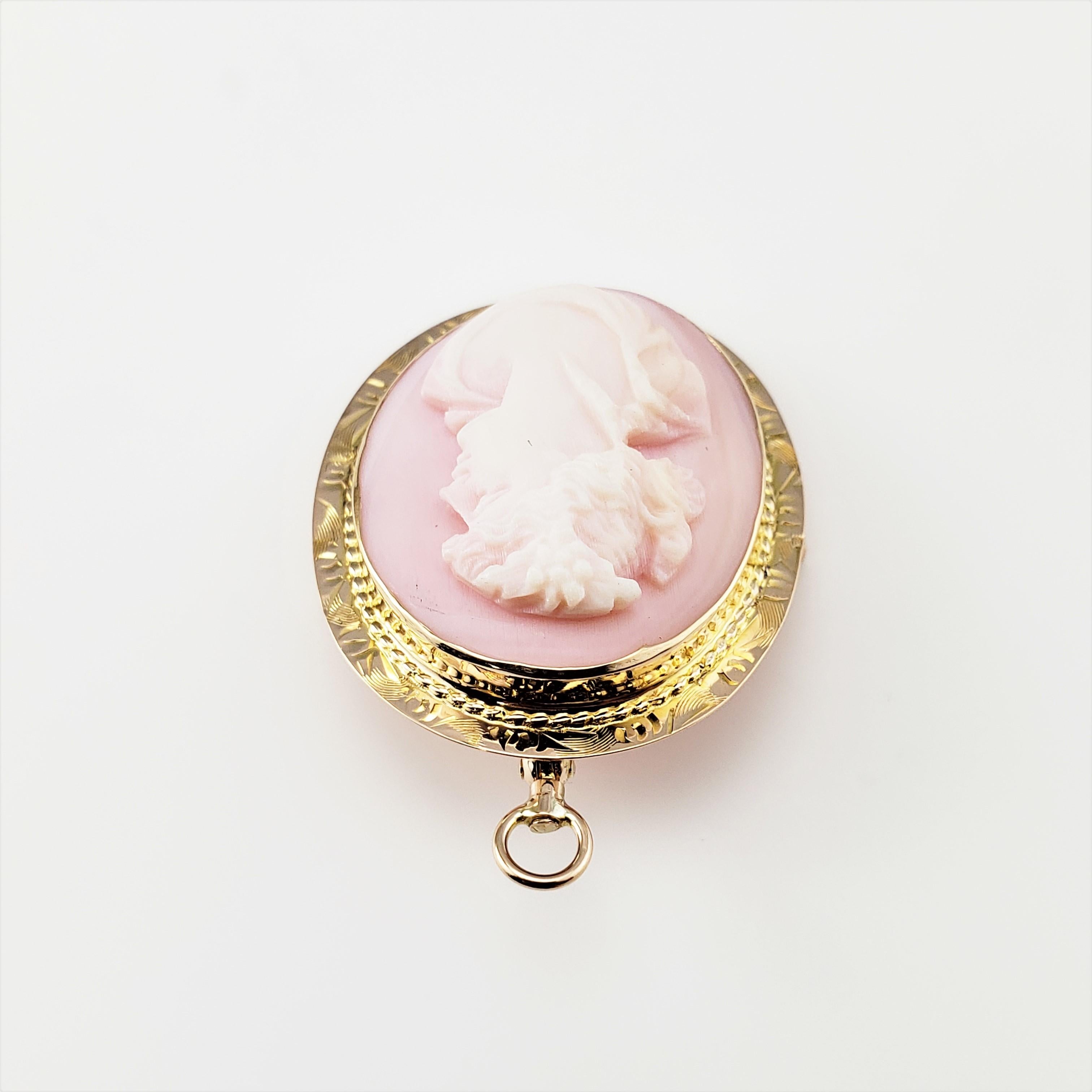 Vintage 10 Karat Yellow Gold Pink  Cameo Pendant/Brooch-

This elegant pink cameo features a lovely lady in profile framed in beautifully detailed 10K yellow gold.  Can be worn as a brooch or a pendant.

*Chain not included

Size:  31 mm x  25
