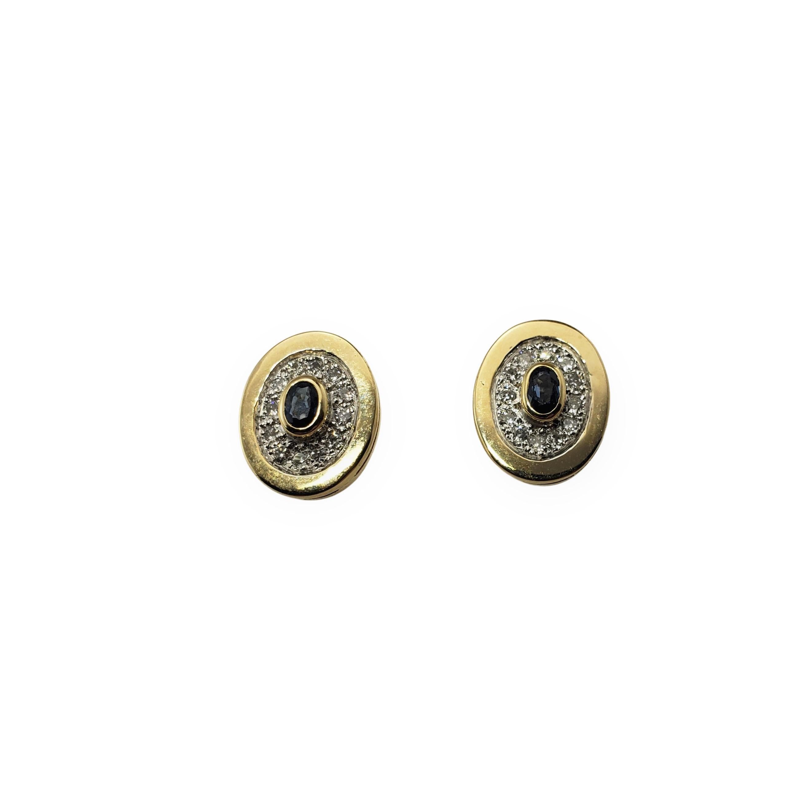 Vintage 14 Karat Yellow Gold Sapphire and Diamond Earrings-

These elegant earrings each feature one oval sapphire (4 mm x 3 mm) and 12 round brilliant cut diamonds set in 14K yellow gold.  Push back closures.

Approximate total diamond weight:  