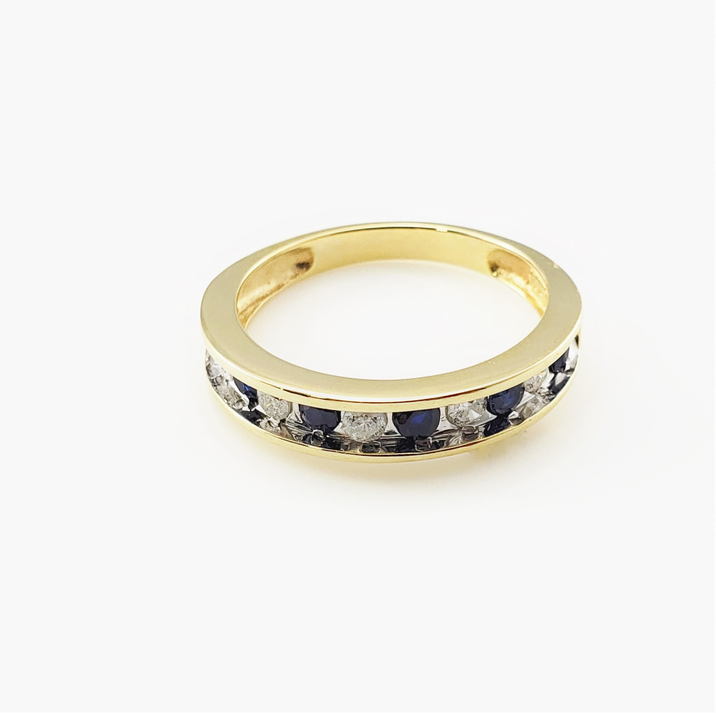 10 Karat Yellow Gold Sapphire and Diamond Ring Size 6.5-

This lovely band features five round brilliant cut diamonds and six blue sapphires set in classic 10K yellow gold.  Width:  4 mm 
Shank:  2 mm.

Approximate total diamond weight:  .20