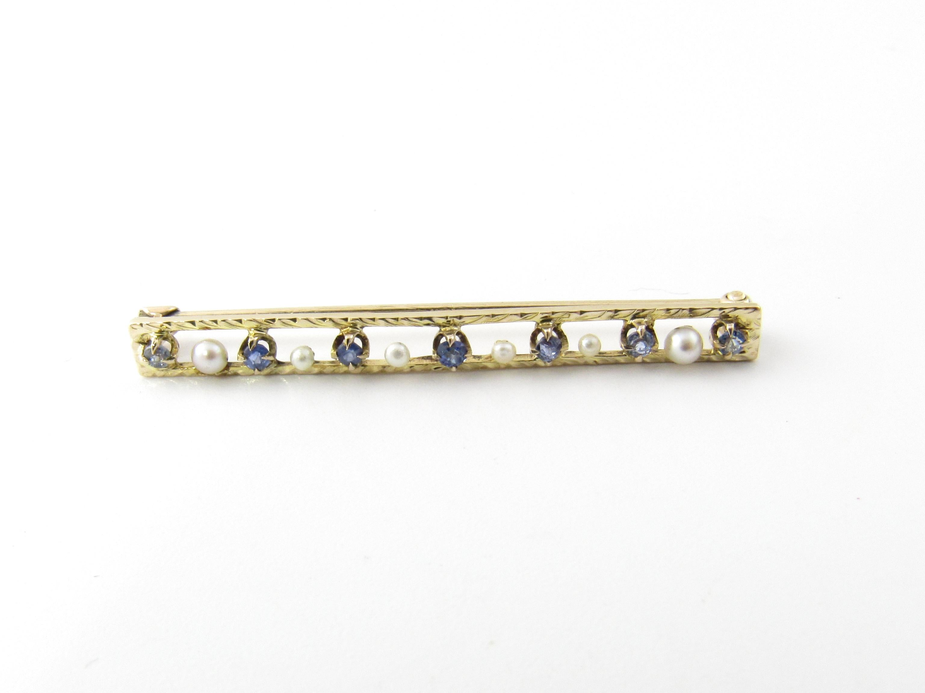 Vintage 10 Karat Yellow Gold Tanzanite and Pearl Brooch/Pin

This elegant brooch features seven round tanzanite and six seed pearls set in beautifully detailed 10K yellow gold.

Size: 39 mm x 4 mm

Weight: 0.9 dwt. / 1.5 gr.

Stamped: 10K

Very good