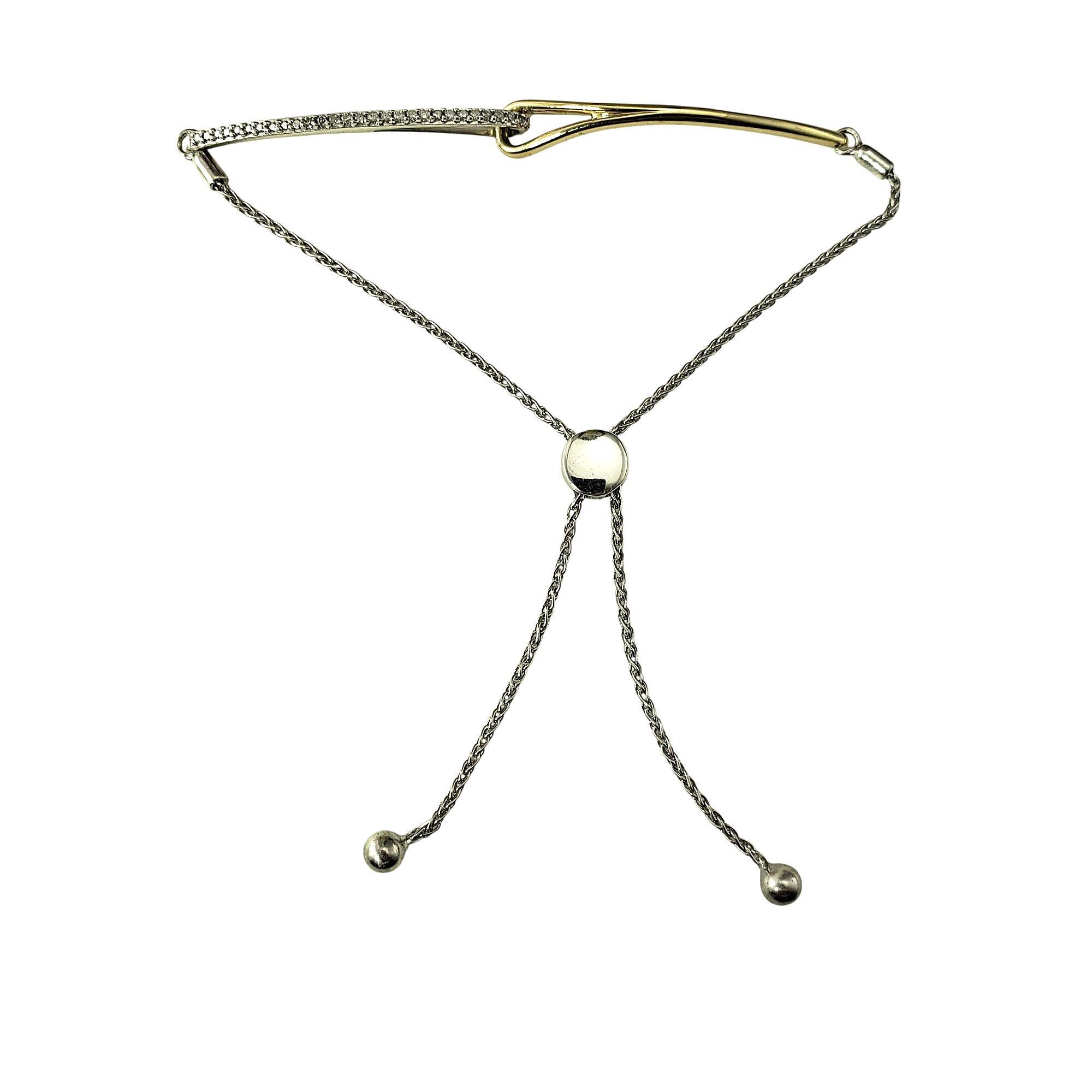 10 Karat Yellow Gold/Sterling Silver and Diamond Bolo Bracelet-

Elegant and versatile, this bracelet is set with 20 round single cut diamonds, adding a touch of sparkle. The adjustable bolo closure ensures a comfortable, custom fit. Crafted in 10K