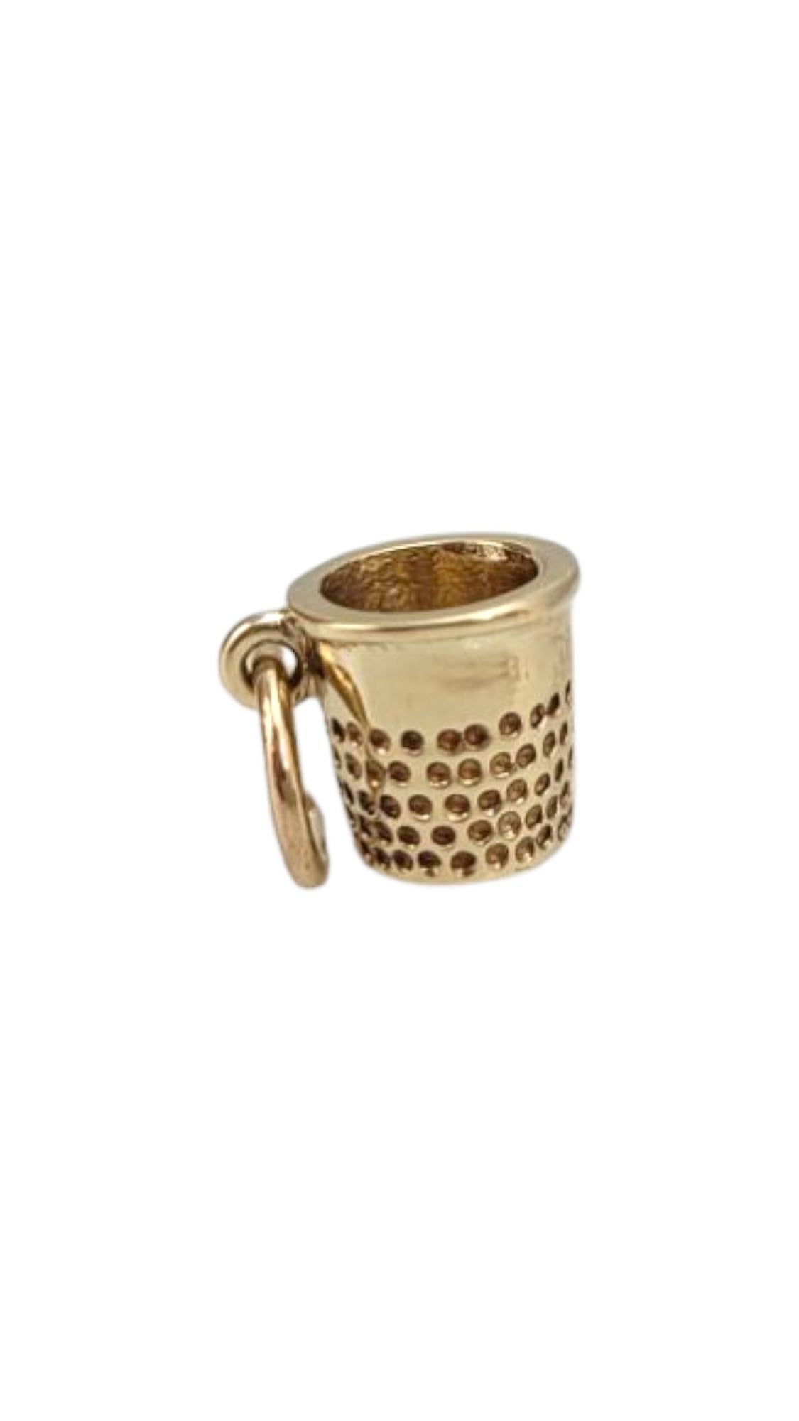 10 Karat Yellow Gold Thimble Charm

Charming and nostalgic, this 10 karat yellow gold thimble charm celebrates craftsmanship and creativity with timeless elegance.

Size: 7.8 mm X 7.1 mm X 7.1 mm

with bale: 13.5 mm

Weight: 1.2 g / 0.8