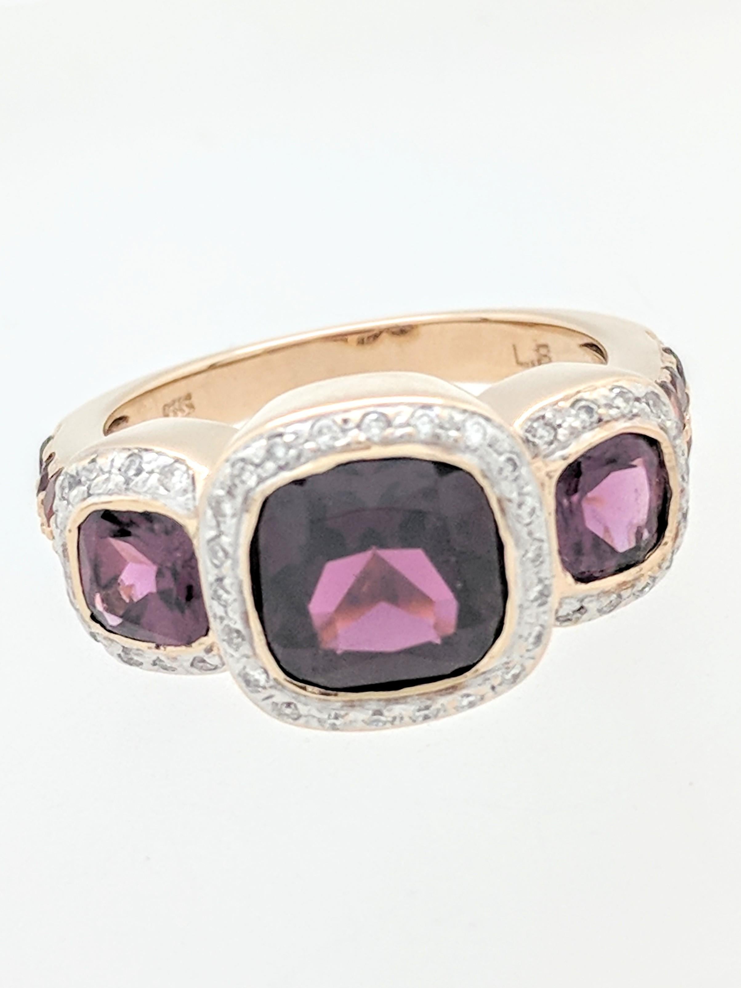 You are viewing a beautiful tourmaline and diamond right hand ring. Any woman would love to add this piece to their collection! This ring is crafted from 10k yellow gold and weighs 6.7 grams. It features approximately (1) 7x7mm cushion cut reddish