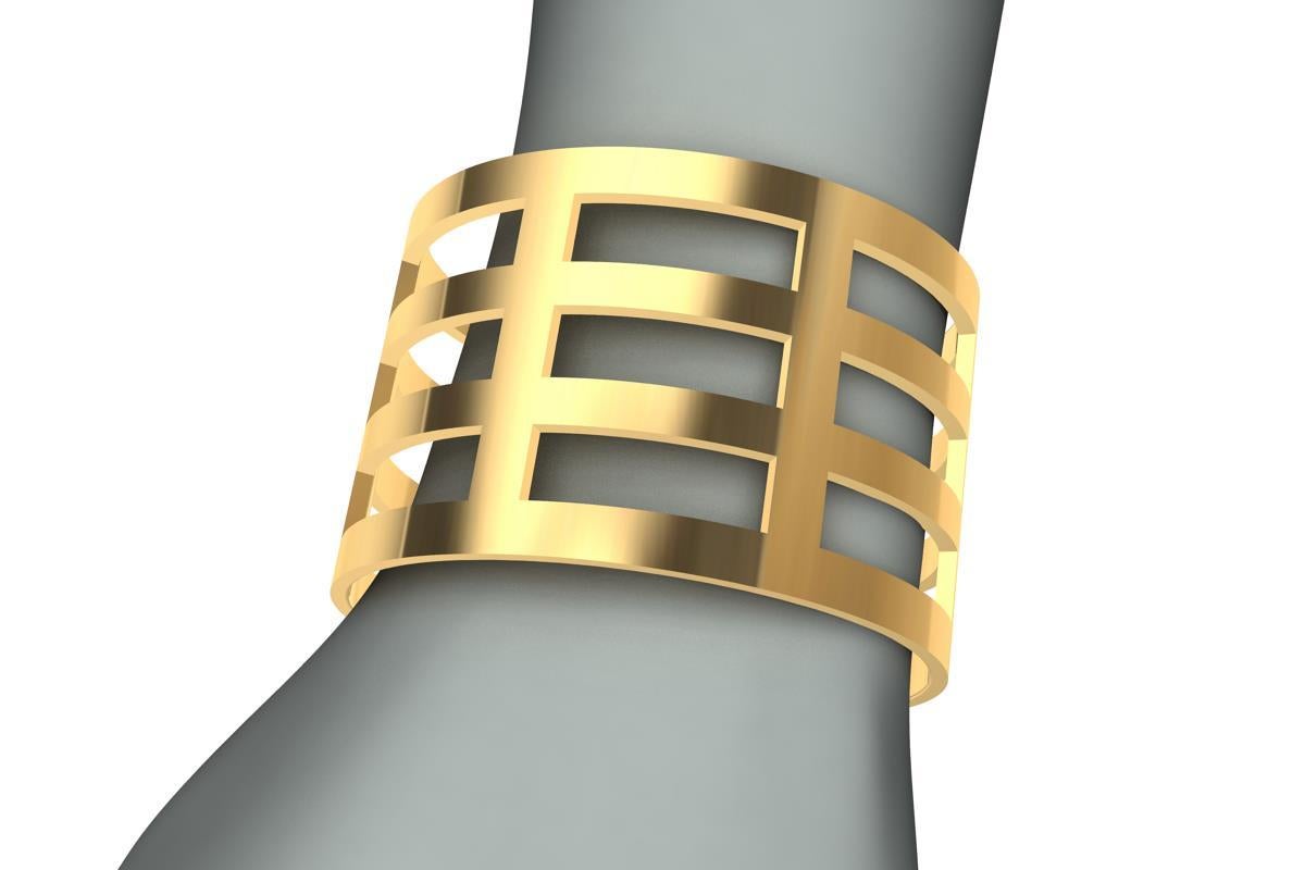 Tiffany designer, Thomas Kurilla designed this after selling original designs to Tiffany's. This wide 18 Karat  Yellow Gold Cuff Bracelet 1 5/8 inch wide and 1.5 mm  thick with fifteen rectangle openings. From my graphic, sculptural, and minimalist