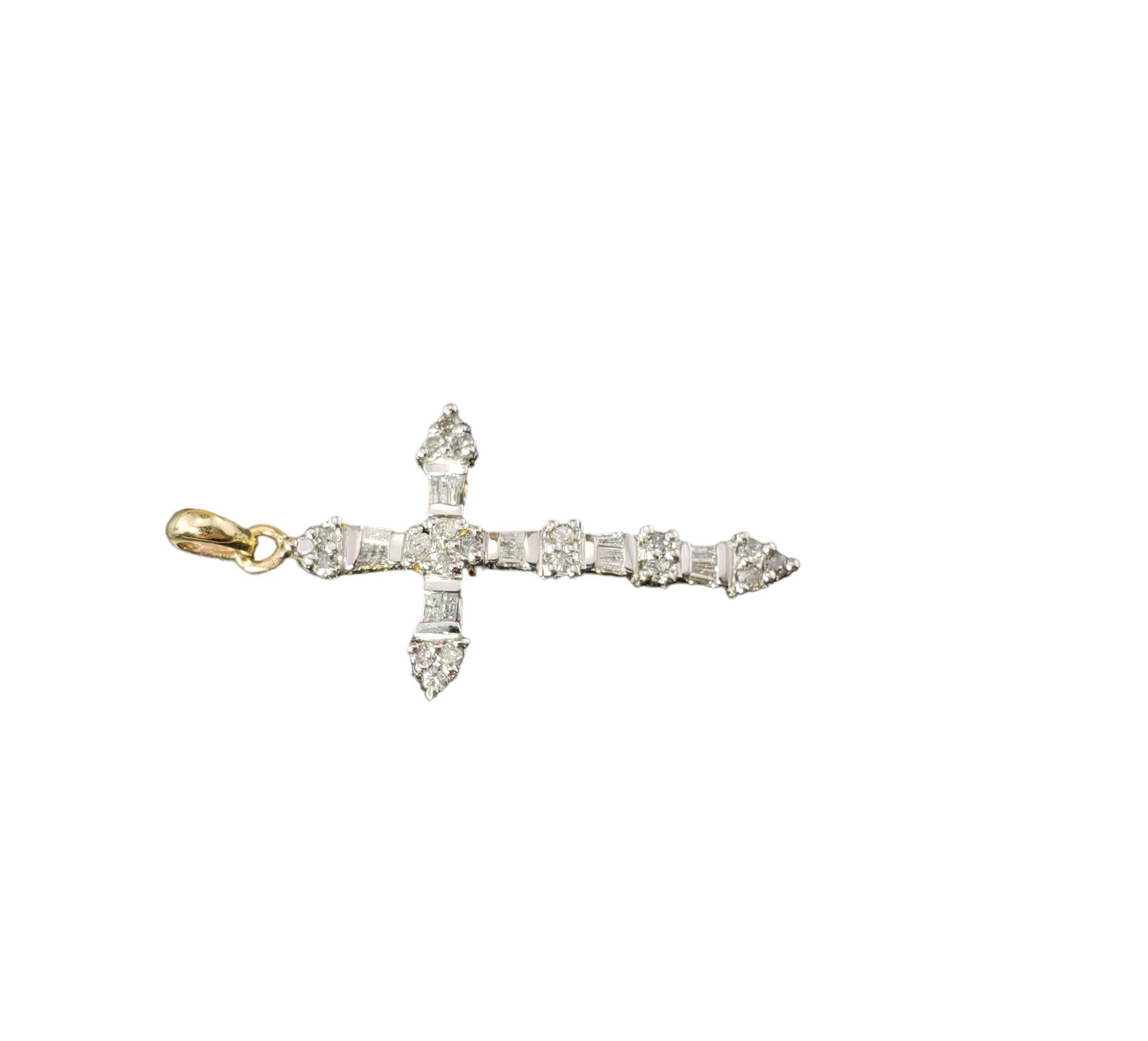 Vintage 10 Karat Yellow and White Gold and Diamond Cross Pendant-

This sparkling cross pendant features 20 round brilliant cut diamonds and 12 baguette cut diamonds set in classic 10K yellow and white gold.

Approximate total diamond weight: .30