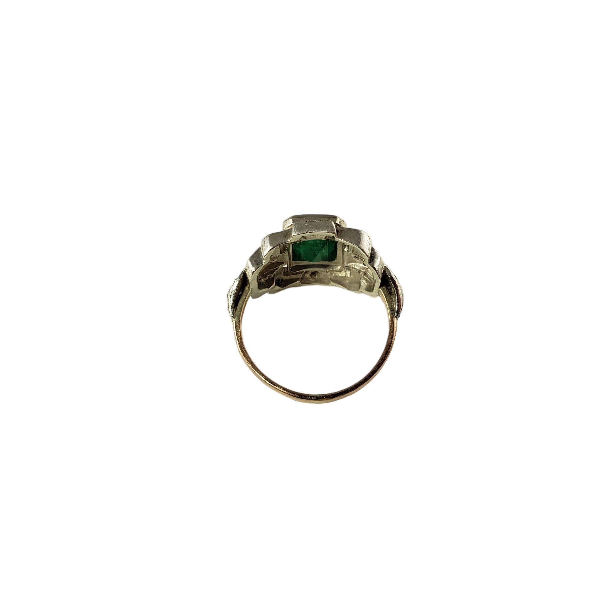 Vintage 10 Karat Yellow/White Gold Emerald and Diamond Ring Size 7 JAGi Certified-

This stunning ring features one emerald cut emerald ( 7 mm x 6 mm) and eight round single cut diamonds set in beautifully detailed 10K white and yellow gold. Width: