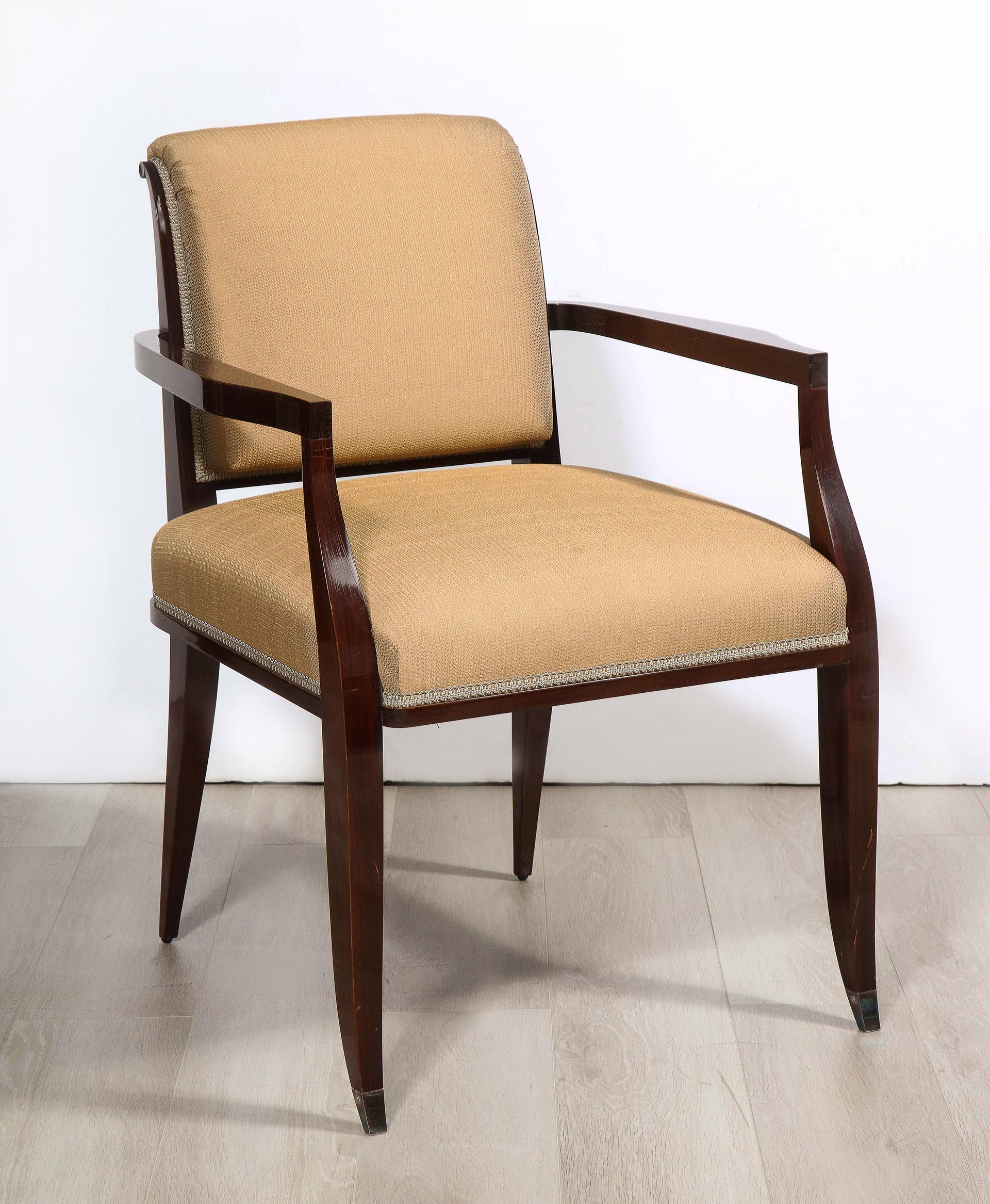 All mahogany chairs each with nickel sabots.

The set consists of 2 arm chairs and 4 side chairs in cream upholstery and 4 side chairs in teal upholstery

Arm: 35