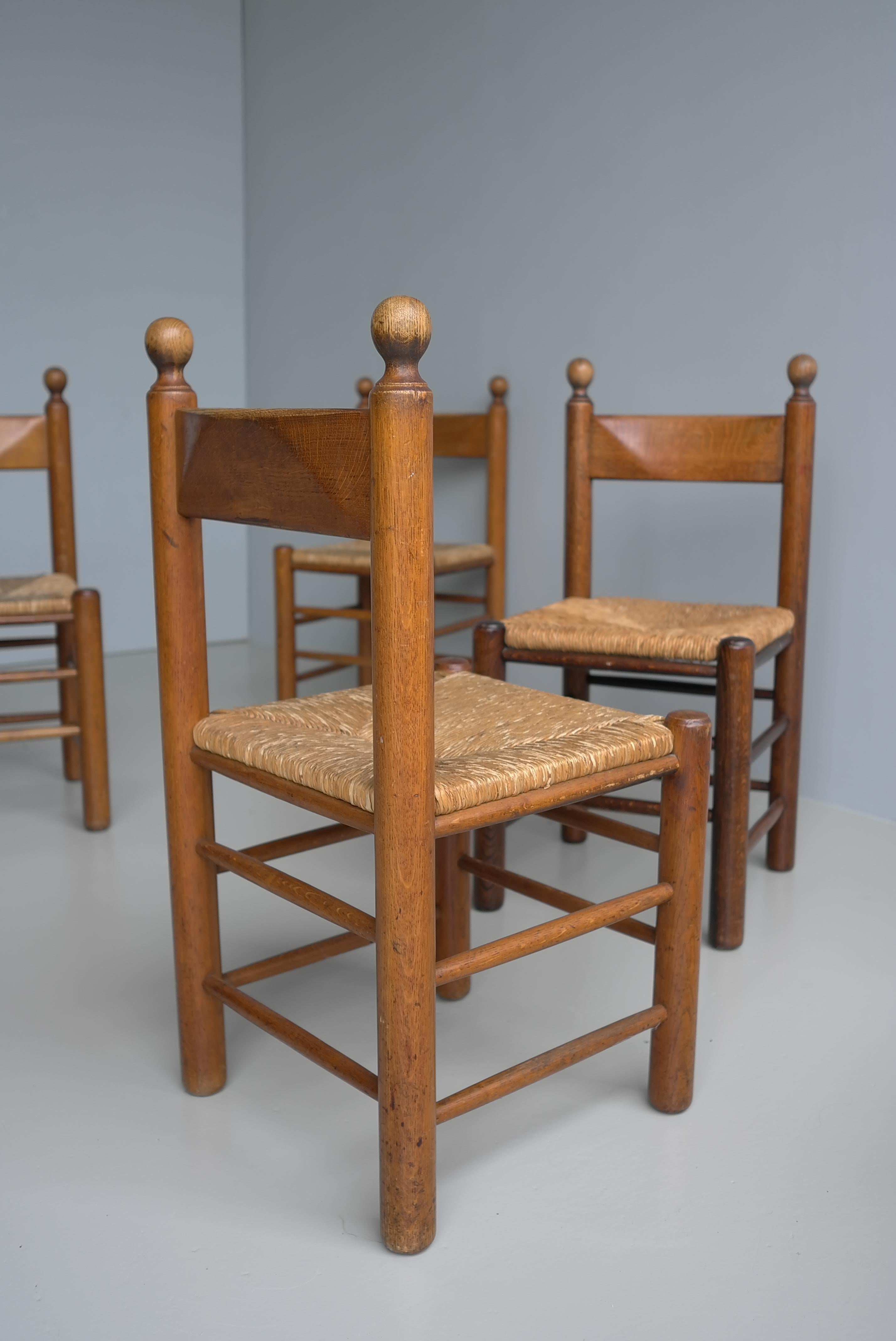 12 Oak and Rush Chairs in Style of Charles Dudouyt , France 1960's In Good Condition For Sale In Den Haag, NL