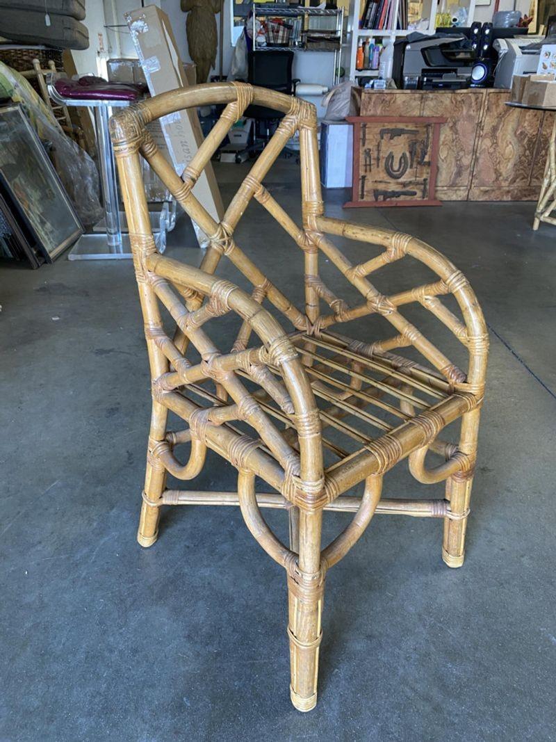 Vintage set of 10 Original Paul Frankl Rattan dining side and armchairs. This dining chair is made up of a total of 10 chairs, 4 side chairs, and 6 armchairs. All chairs feature a wonderful Midcentury slanted leg rattan design with a geometric back
