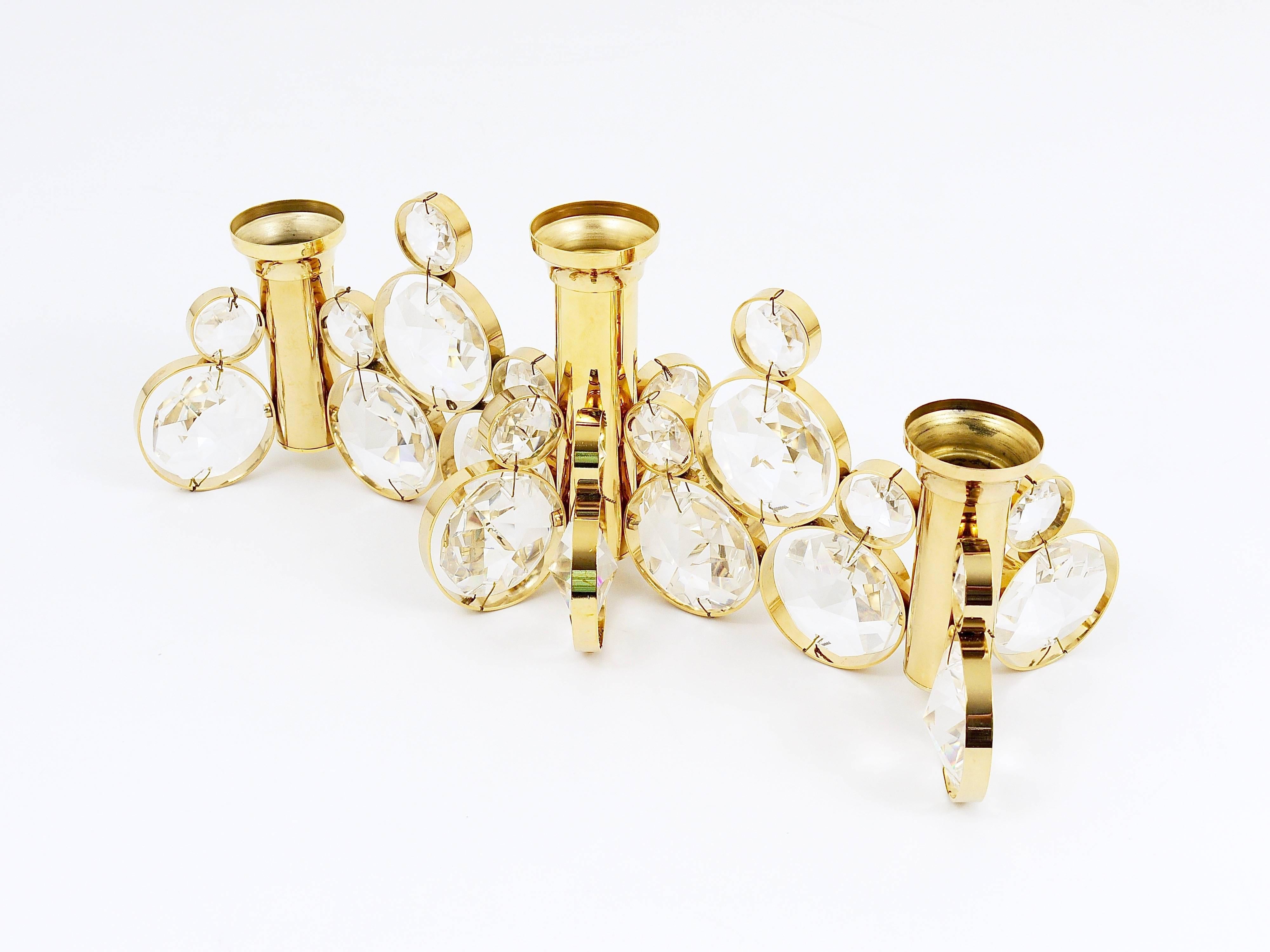 Up to five beautiful candle holders in the style of Gaetano Sciolari. Manufactured in the 1970s by Palwa Germany. Made of gold-plated brass with huge faceted crystals. In excellent condition. There are five identical candleholders available, the