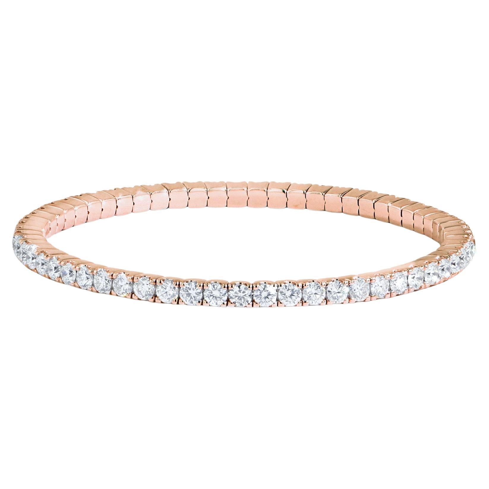 Iconic and stylish, this flexible diamond bangle bracelet is designed to make a statement. Crafted from 18K White, Yellow, or Rose Gold, with round brilliant cut diamonds, it effortlessly complements any outfit. Whether worn alone or stacked, it