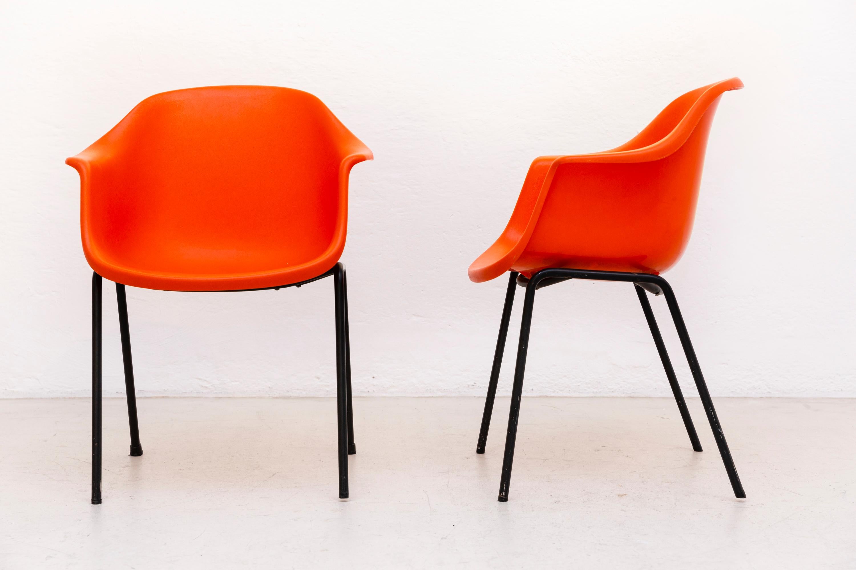 A set of 10 Polaris armchairs by Eero Aarnio for Asko, designed in 1966.
Orange plastic, metal legs.